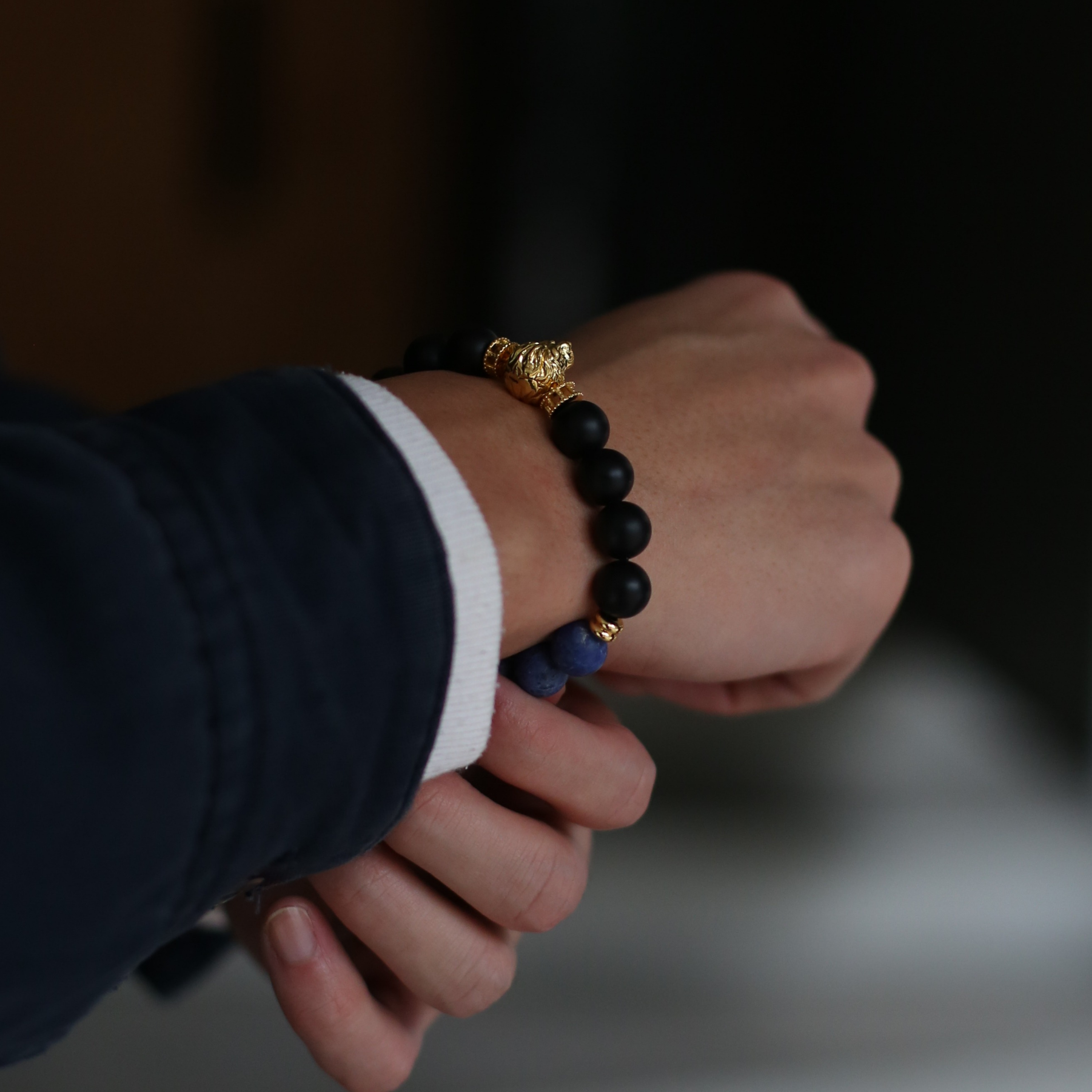 The king of the jungle. The gold lion head charm is made to impress.  Men's lion bracelet with gemstone crystals highlights the detail of the lion jewellery and the custom handcrafted finishing brings the vividness of the lion jewellery. Azuro Republic lion bracelet is a silver bracelet with  925 silver plated with 3 microns 24k gold.