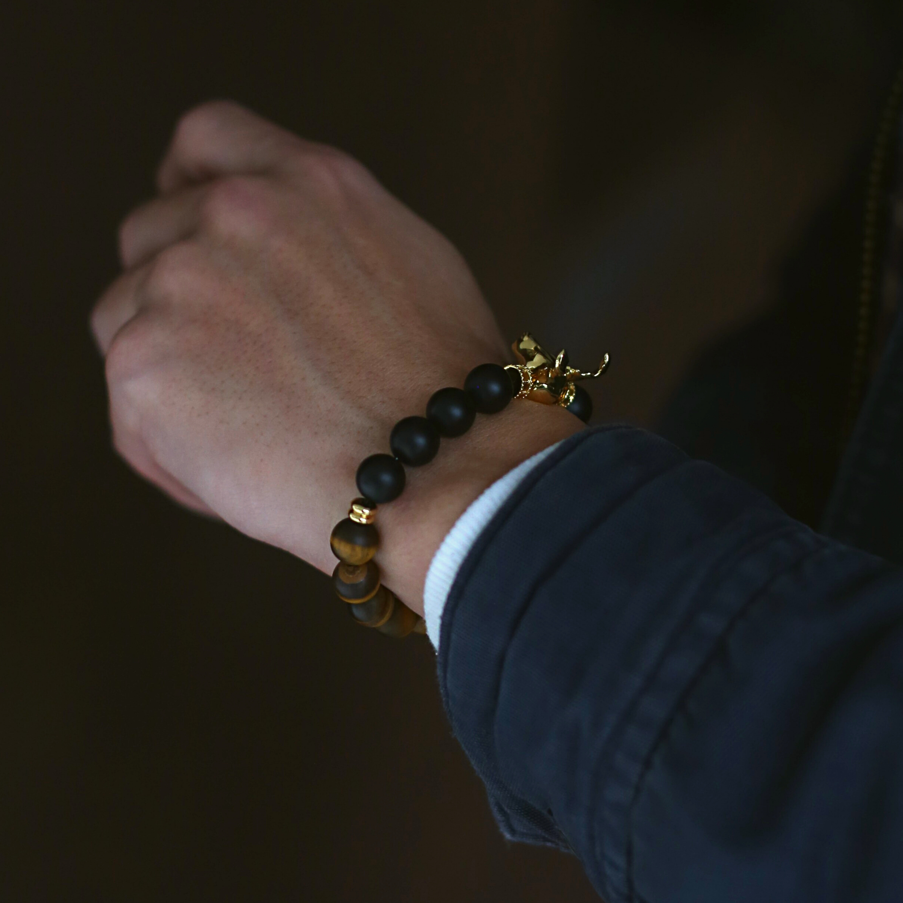 The Gold Deer bracelet is originated from Milwaukee. It is a masculine figure in the wild forest. Various selection of charms beads combines with exquisite grand AAA gemstones. This men's beaded bracelet is a combination of gold deer jewelry with custom handcrafted crystals and gemstones. Master a masculine gold deer design with confidence and style yourself with the personalized beaded bracelet.