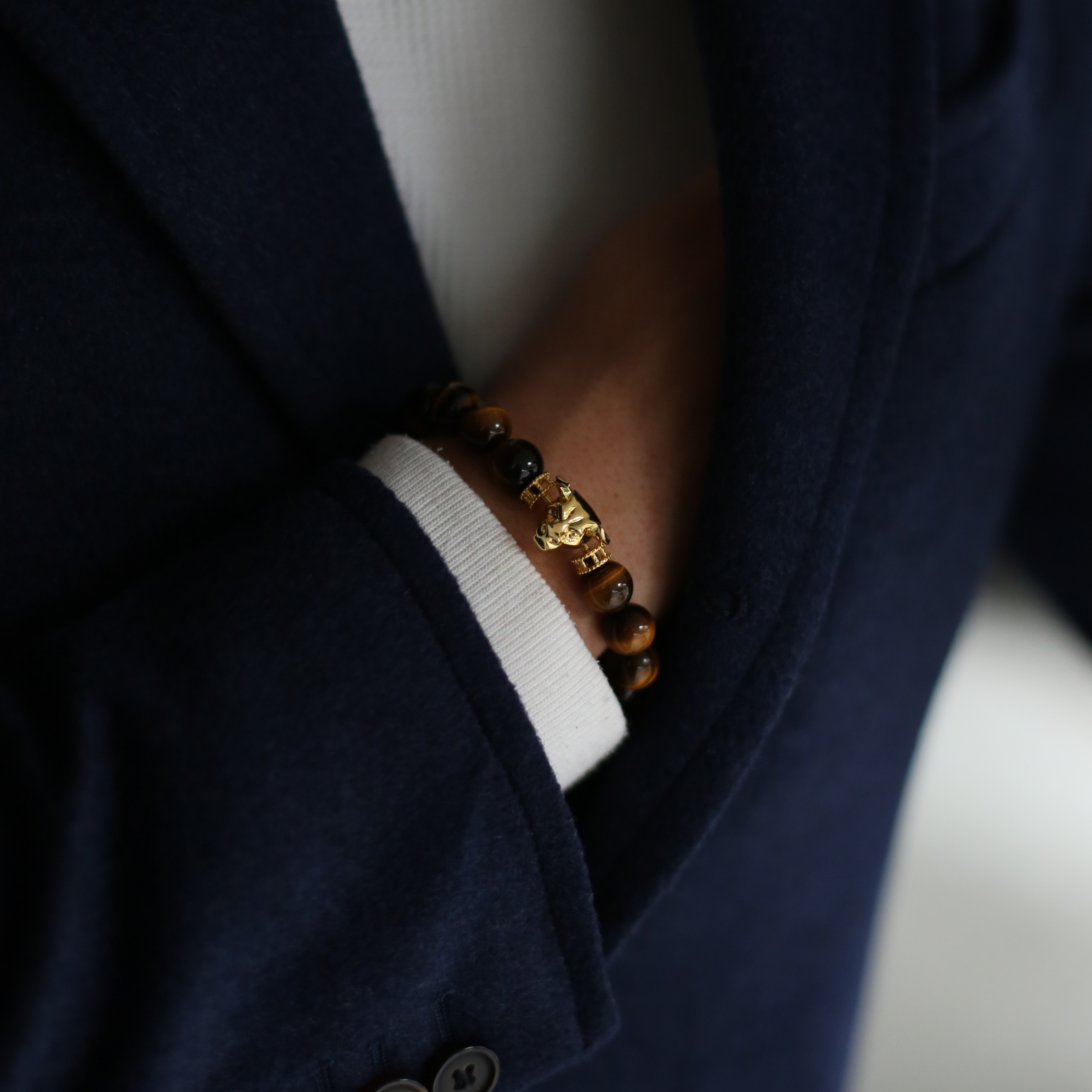 Selected three men's beaded bracelets, obsidian, turquoise, and tiger eye match perfectly with Azuro Republic gold charm beads. The beaded bracelets cover the main color choices for men, black, blue, brown, and portrait a subtle gentleman look.