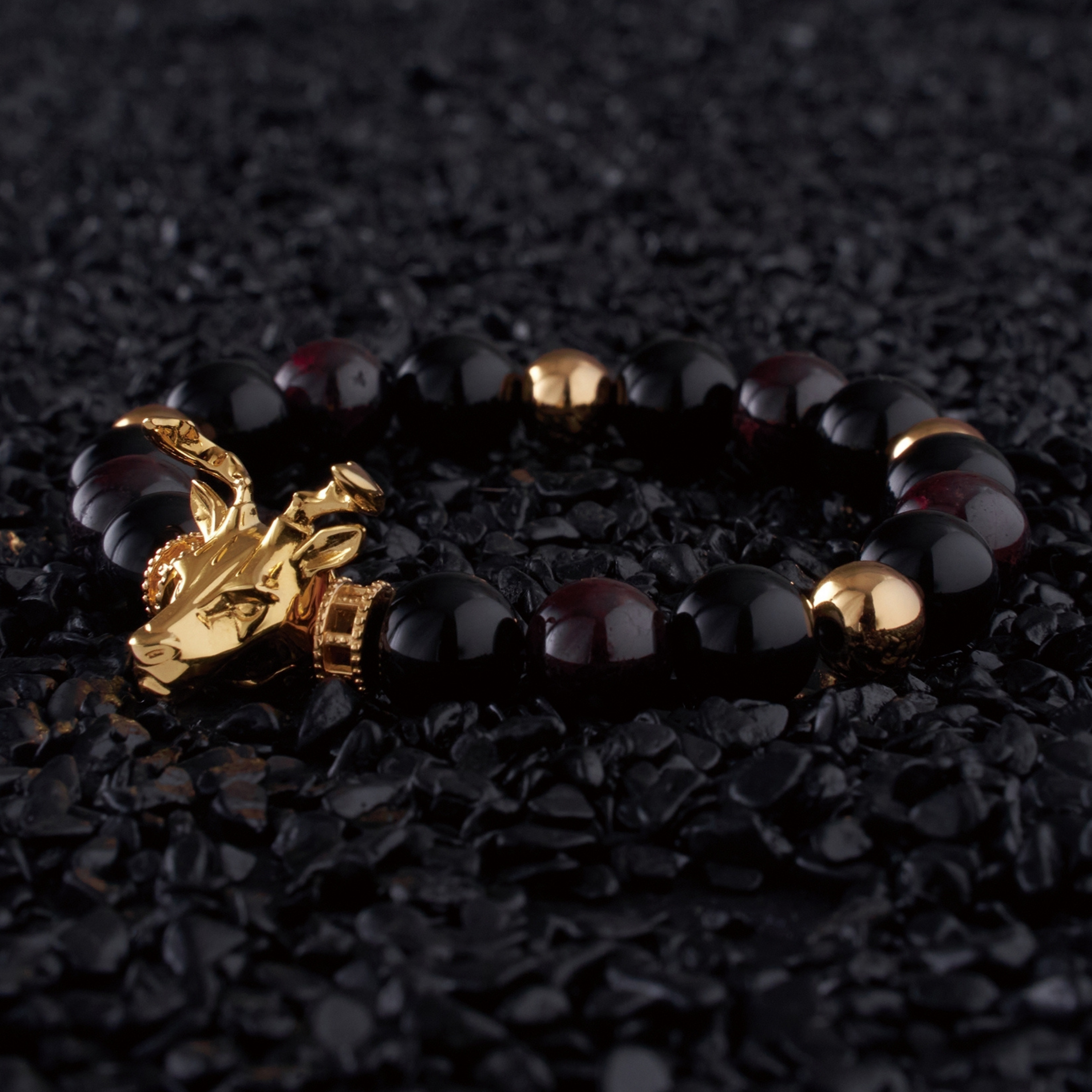 The Gold Deer bracelet idea originated from Milwaukee. It is a masculine figure in the wild forest. Gold beaded bracelet with obsidian and tiger eye bracelet crystal uplifts inner strength and absorbs negativity. The custom Gold Deer bracelet with gold plated beads and tiger eye bracelet and obsidian crystals are a great men's bracelet to collect.