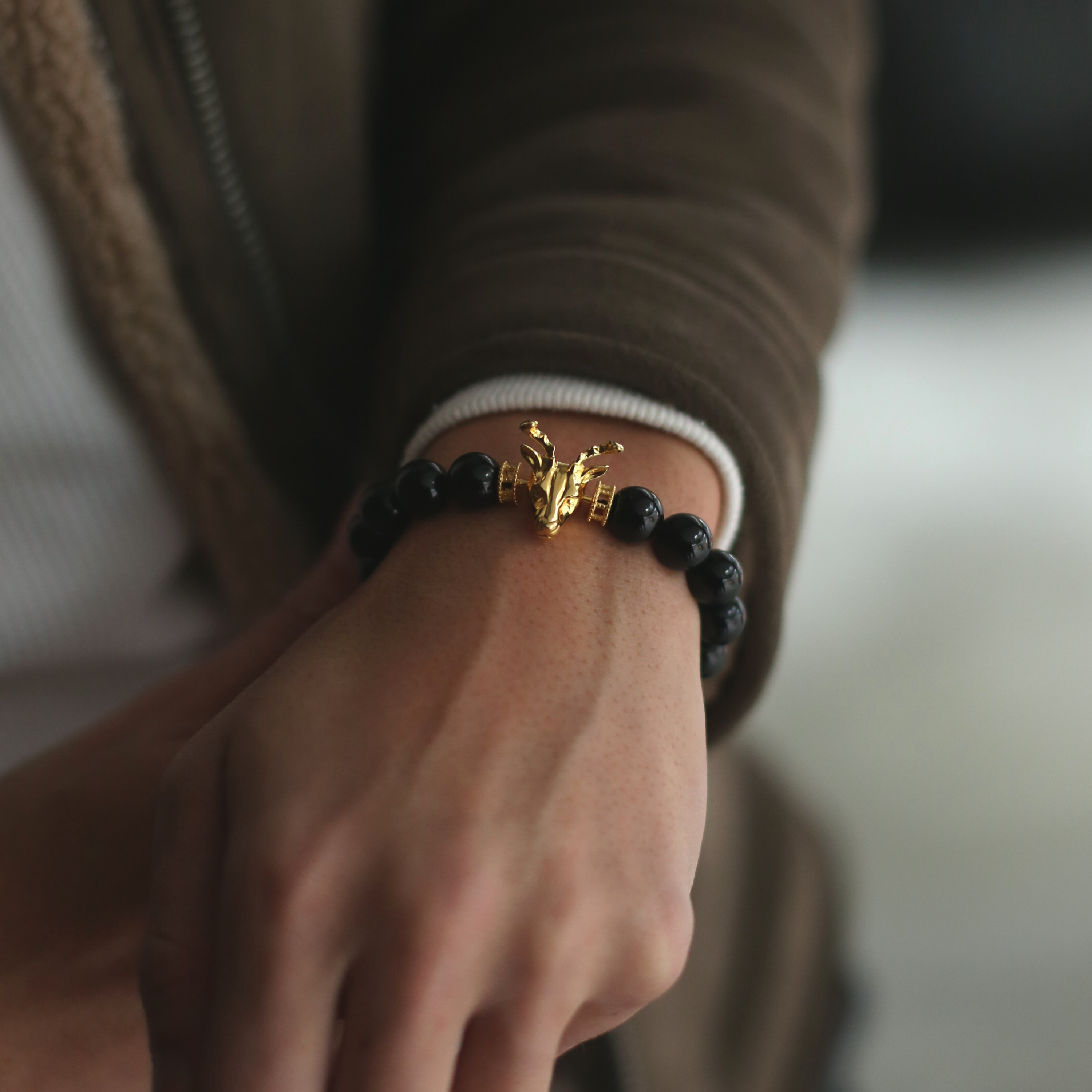 The Gold Deer bracelet is originated from Milwaukee. It is a masculine figure in the wild forest. Various selection of charms beads combines with exquisite grand AAA gemstones. This men's beaded bracelet is a combination of gold deer jewelry with custom handcrafted crystals and gemstones. Master a masculine gold deer design with confidence and style yourself with the personalized beaded bracelet.