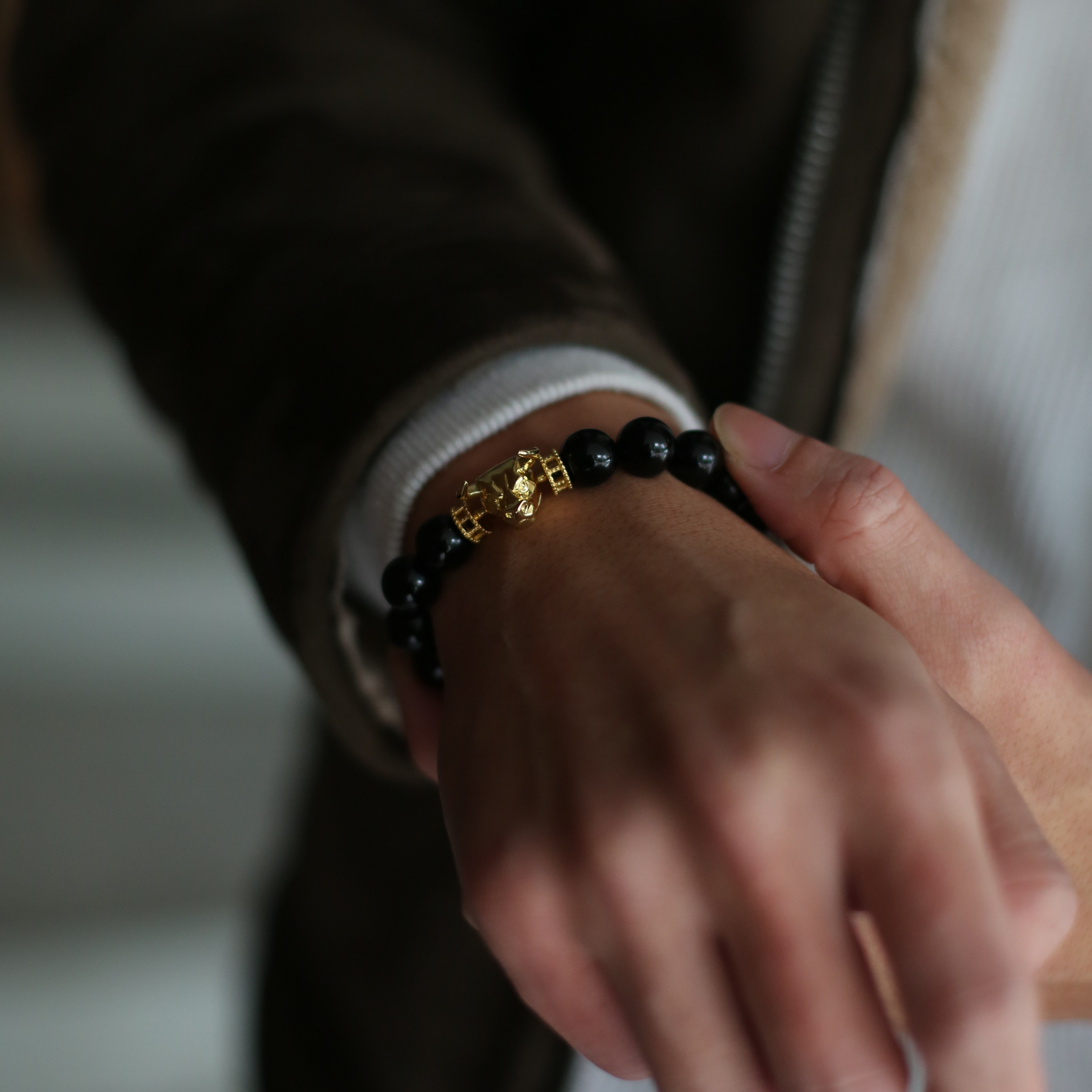 Selected three men's beaded bracelets, obsidian, turquoise, and tiger eye match perfectly with Azuro Republic gold charm beads. The beaded bracelets cover the main color choices for men, black, blue, brown, and portrait a subtle gentleman look.