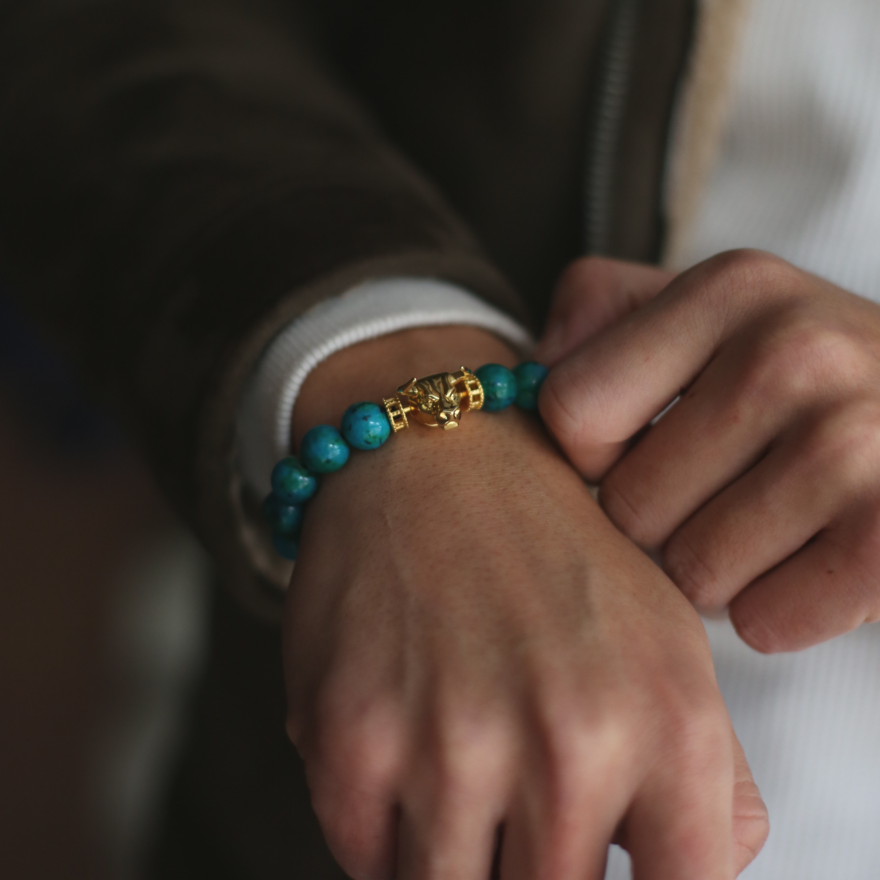Selected three men's beaded bracelets, obsidian, turquoise, and tiger eye match perfectly with Azuro Republic gold charm beads. The beaded bracelets cover the main color choices for men, black, blue, brown, and portrait a subtle gentleman look.