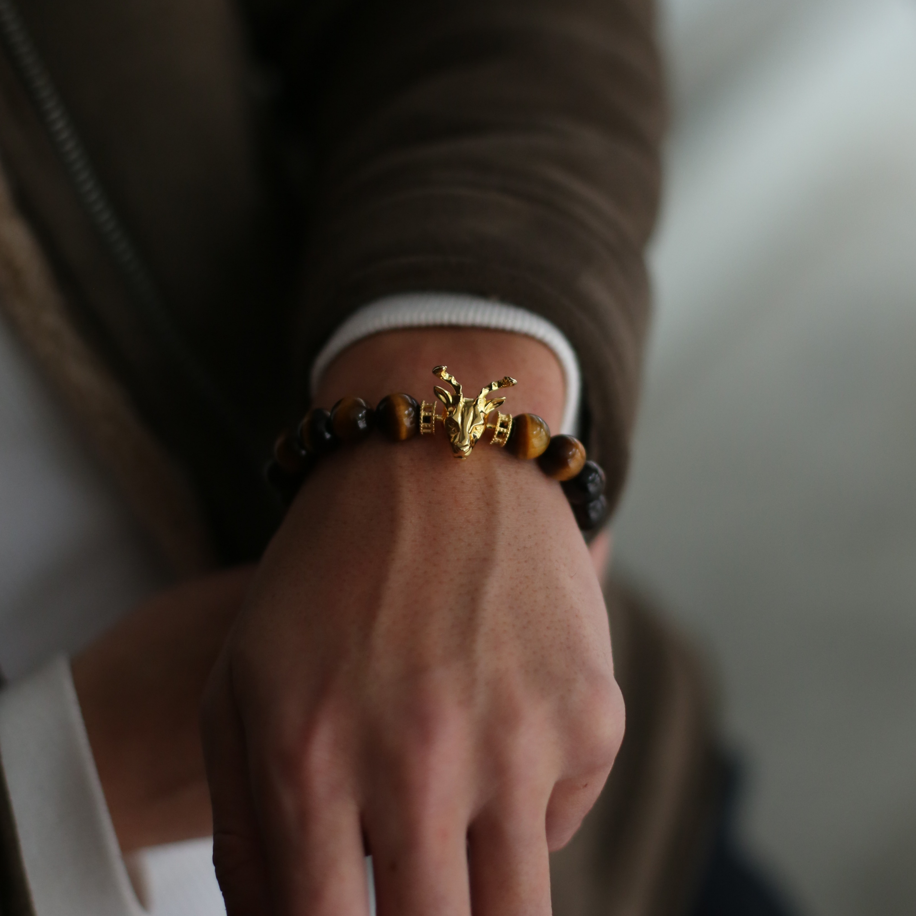 Selected three men's beaded bracelets, obsidian, turquoise, and tiger eye match perfectly with Azuro Republic gold charm beads. The beaded bracelets cover the main color choices for men, black, blue, brown, and portrait a subtle gentleman look.