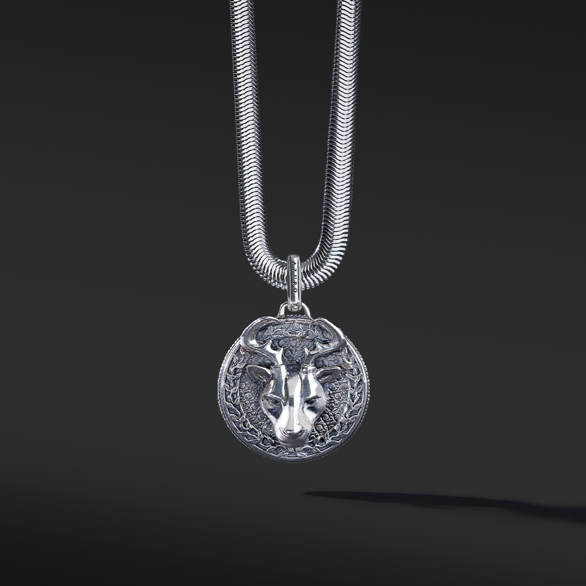 The silver deer pendant necklace for men is a unique existing. The idea originated from Milwaukee, Wisconsin. The deer is a masculine figure in the wild forest. If you are confident enough to master the bold silver pendant design, this buck head is a must-have silver pendant for men.