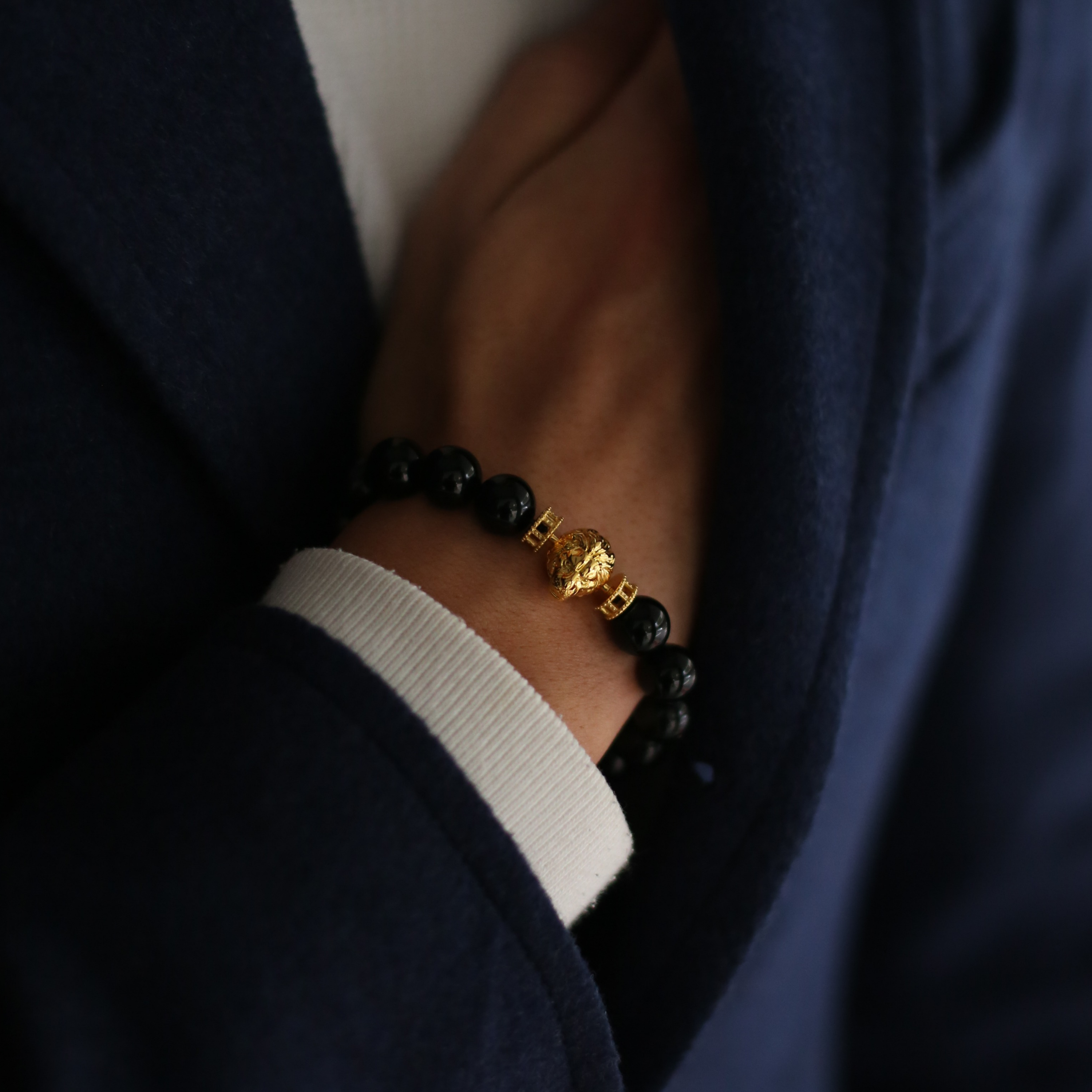 Selected three men's beaded bracelets, obsidian, turquoise, and tiger eye match perfectly with Azuro Republic gold charm beads. The beaded bracelets cover the main color choices for men, black, blue, brown, and portrait a subtle gentleman look.