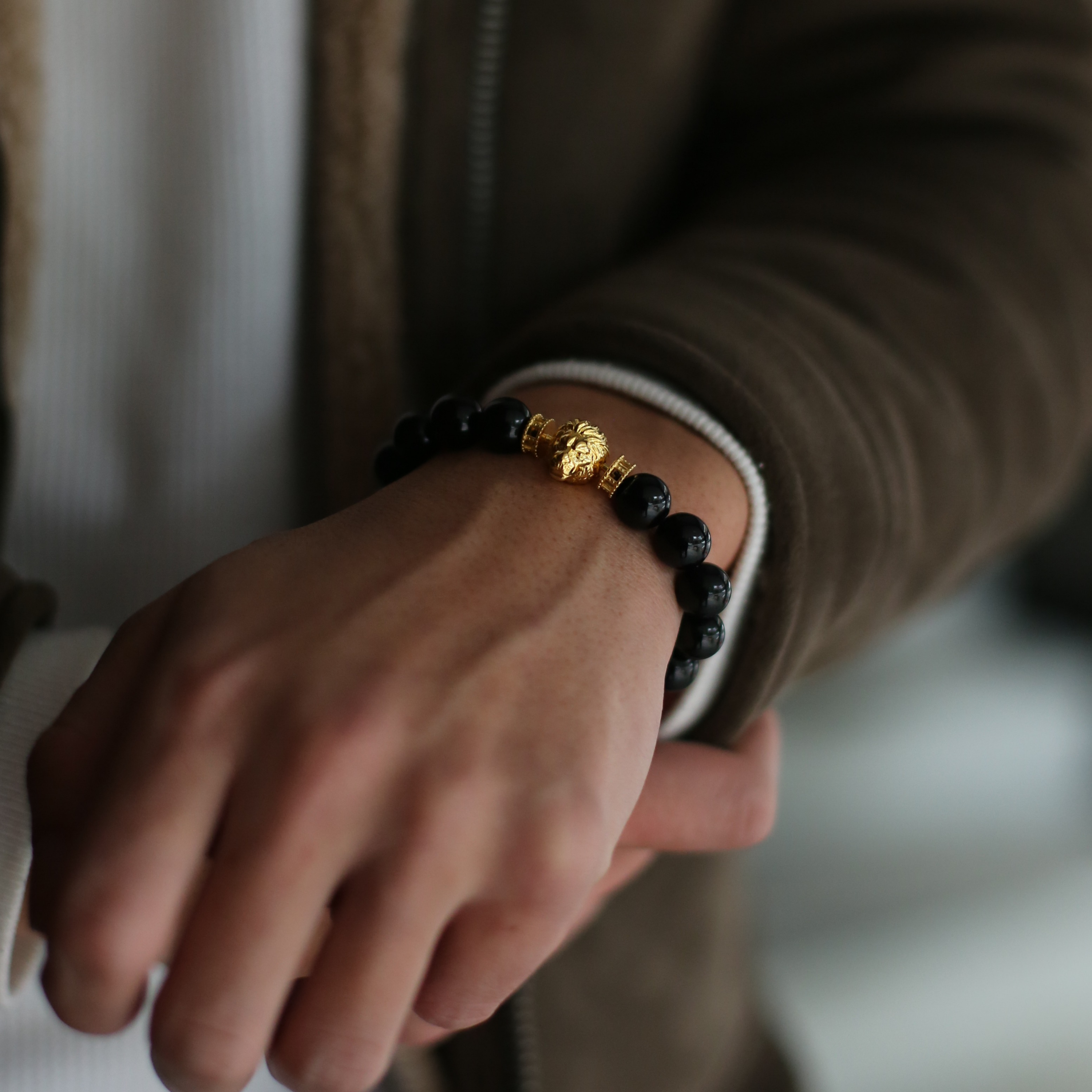 The king of the jungle. The gold lion head charm is made to impress.  Men's lion bracelet with gemstone crystals highlights the detail of the lion jewellery and the custom handcrafted finishing brings the vividness of the lion jewellery. Azuro Republic lion bracelet is a silver bracelet with  925 silver plated with 3 microns 24k gold.