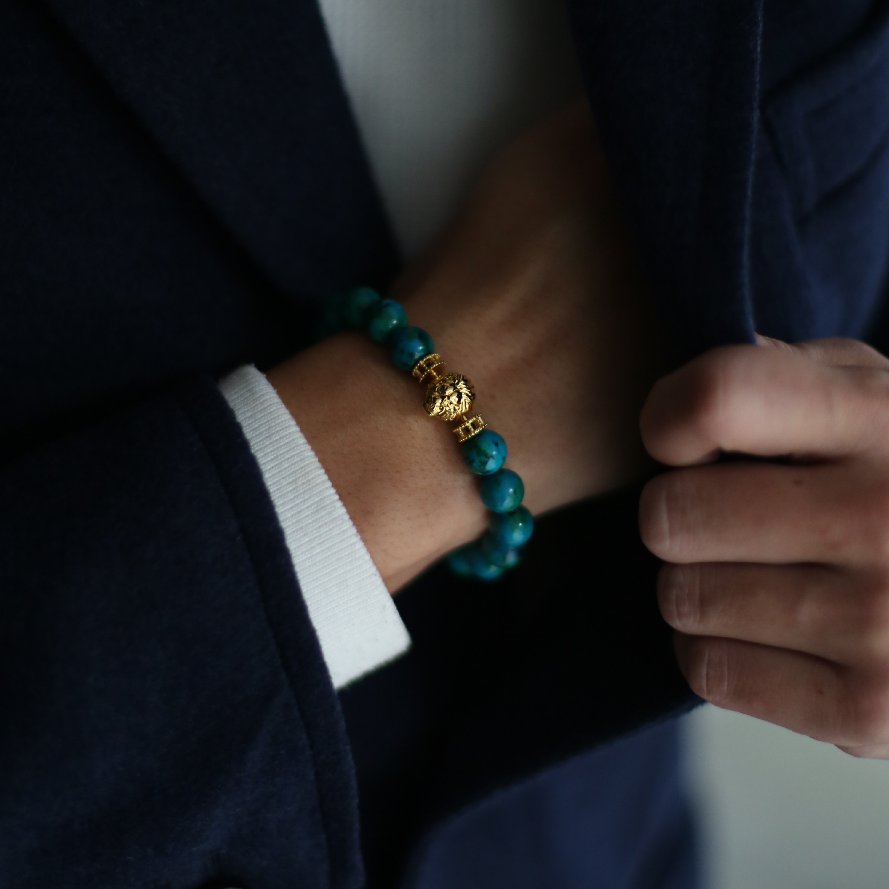 Selected three men's beaded bracelets, obsidian, turquoise, and tiger eye match perfectly with Azuro Republic gold charm beads. The beaded bracelets cover the main color choices for men, black, blue, brown, and portrait a subtle gentleman look.