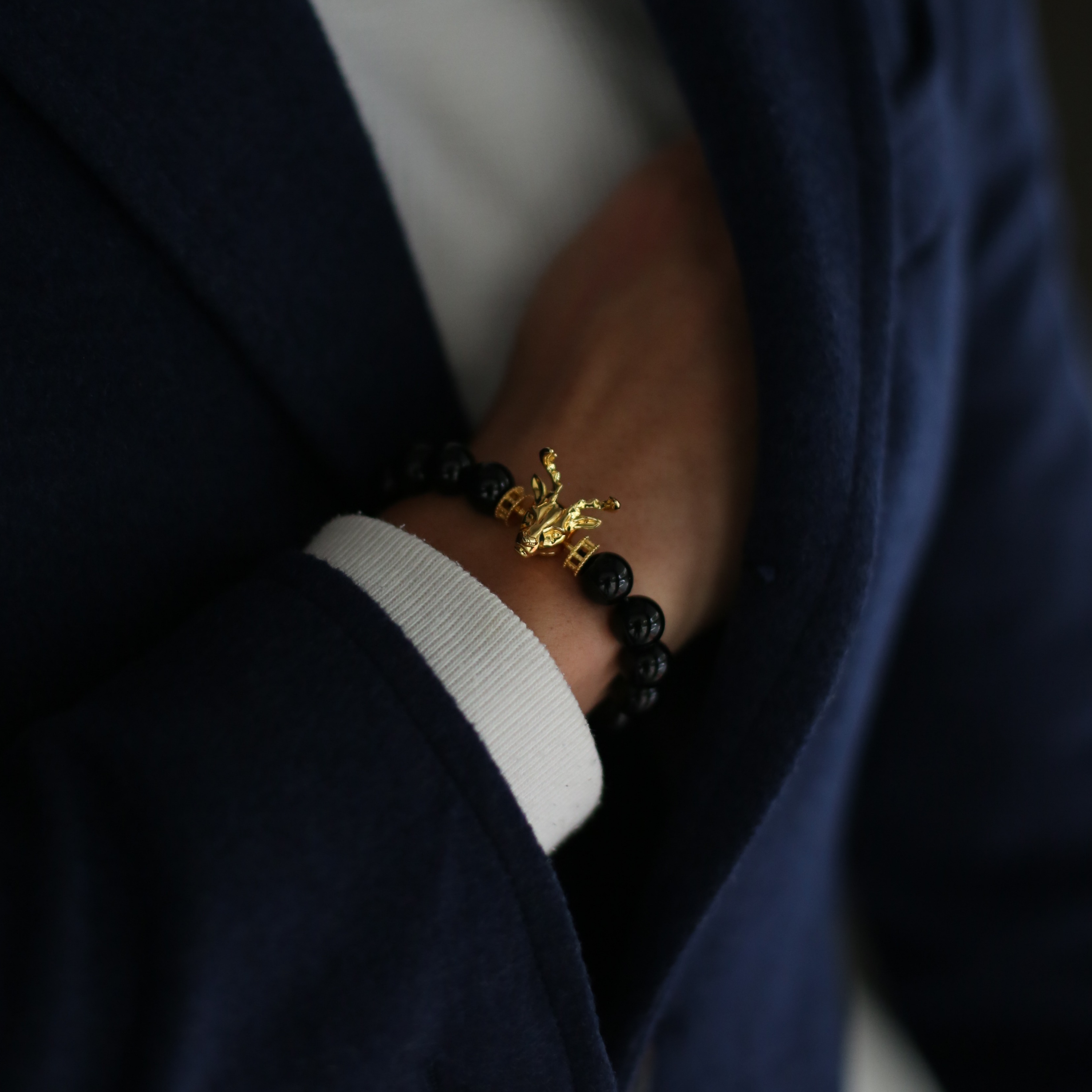 Selected three men's beaded bracelets, obsidian, turquoise, and tiger eye match perfectly with Azuro Republic gold charm beads. The beaded bracelets cover the main color choices for men, black, blue, brown, and portrait a subtle gentleman look.