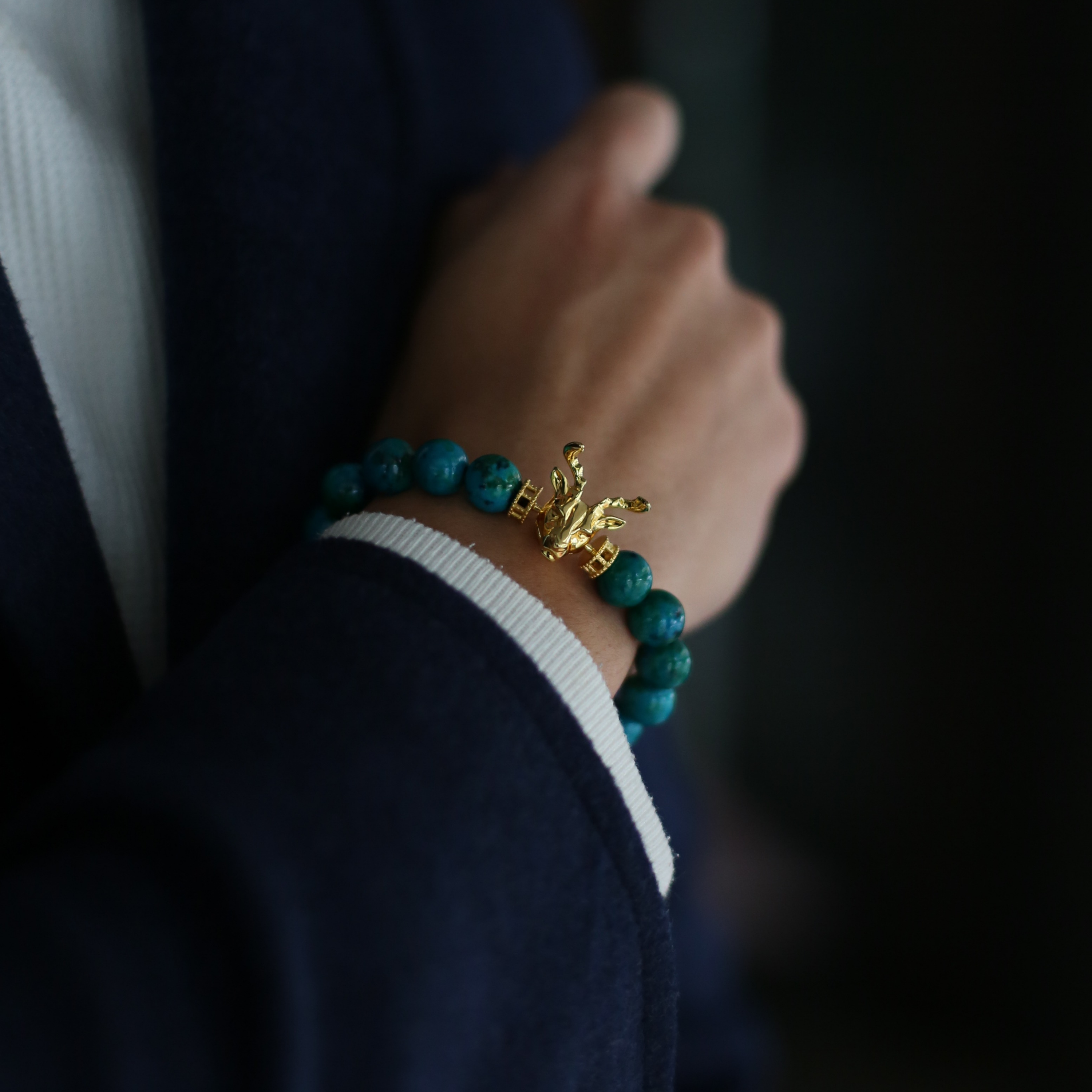 Selected three men's beaded bracelets, obsidian, turquoise, and tiger eye match perfectly with Azuro Republic gold charm beads. The beaded bracelets cover the main color choices for men, black, blue, brown, and portrait a subtle gentleman look.
