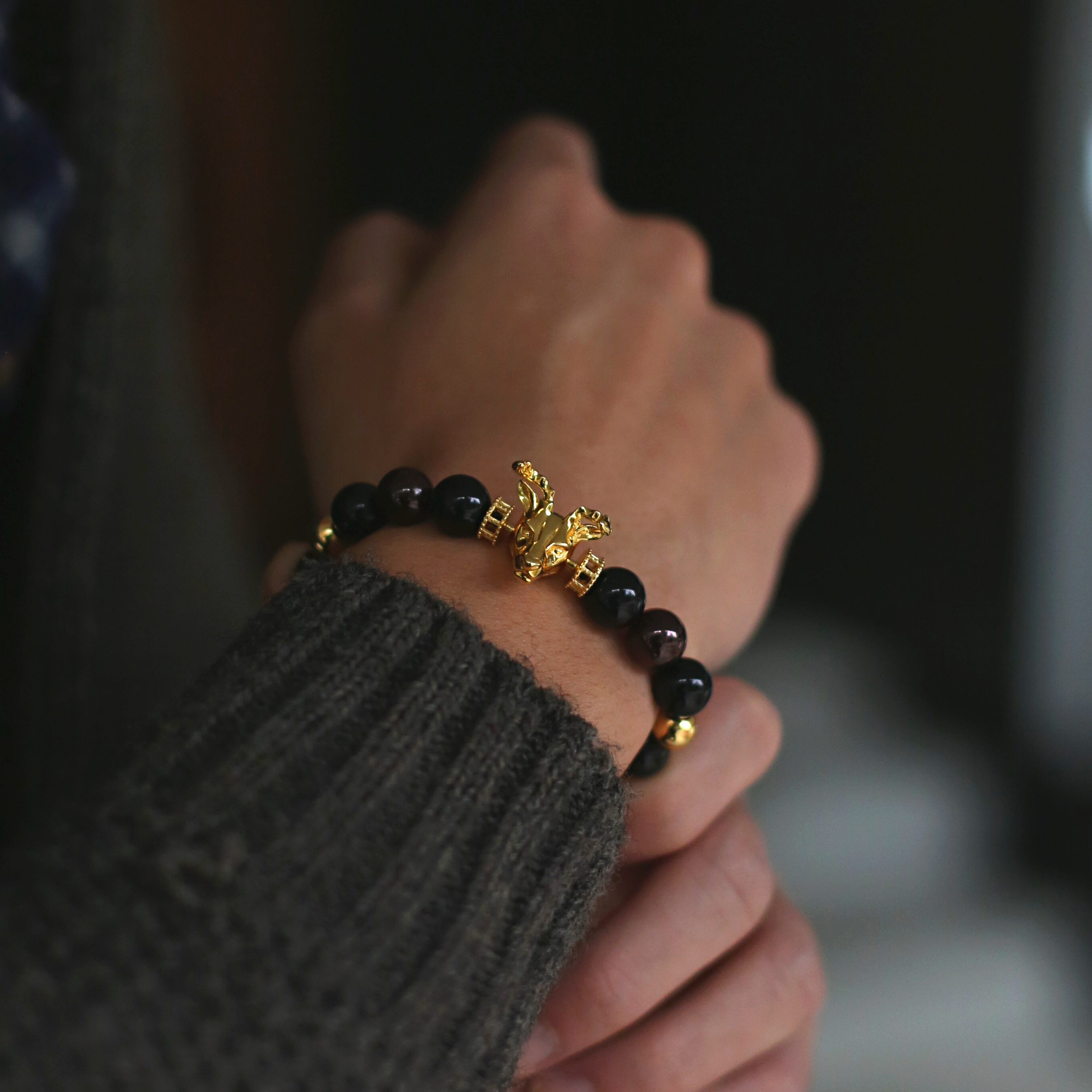 The Gold Deer bracelet idea originated from Milwaukee. It is a masculine figure in the wild forest. Gold beaded bracelet with obsidian and tiger eye bracelet crystal uplifts inner strength and absorbs negativity. The custom Gold Deer bracelet with gold plated beads and tiger eye bracelet and obsidian crystals are a great men's bracelet to collect.
