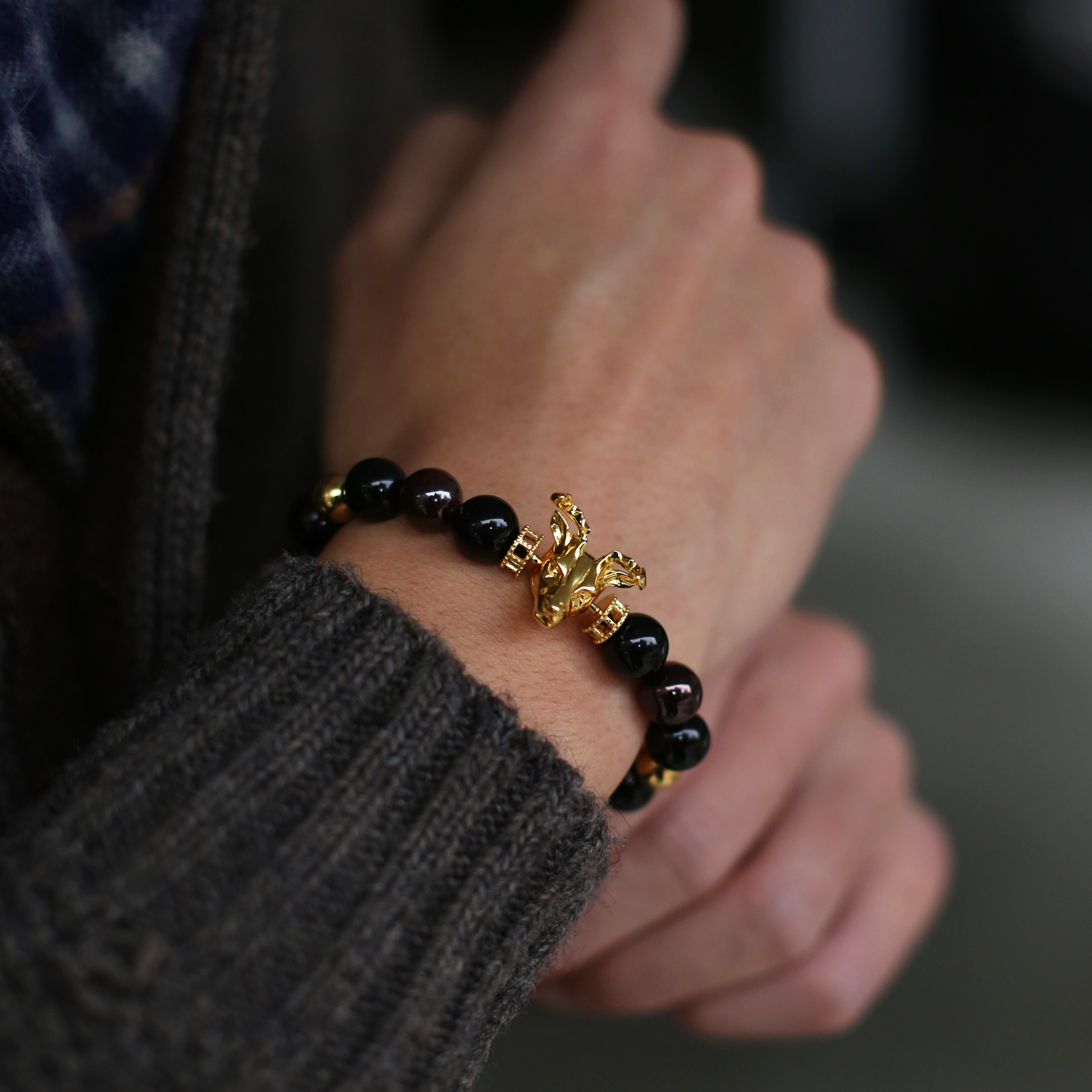 The Gold Deer bracelet idea originated from Milwaukee. It is a masculine figure in the wild forest. Gold beaded bracelet with obsidian and tiger eye bracelet crystal uplifts inner strength and absorbs negativity. The custom Gold Deer bracelet with gold plated beads and tiger eye bracelet and obsidian crystals are a great men's bracelet to collect.