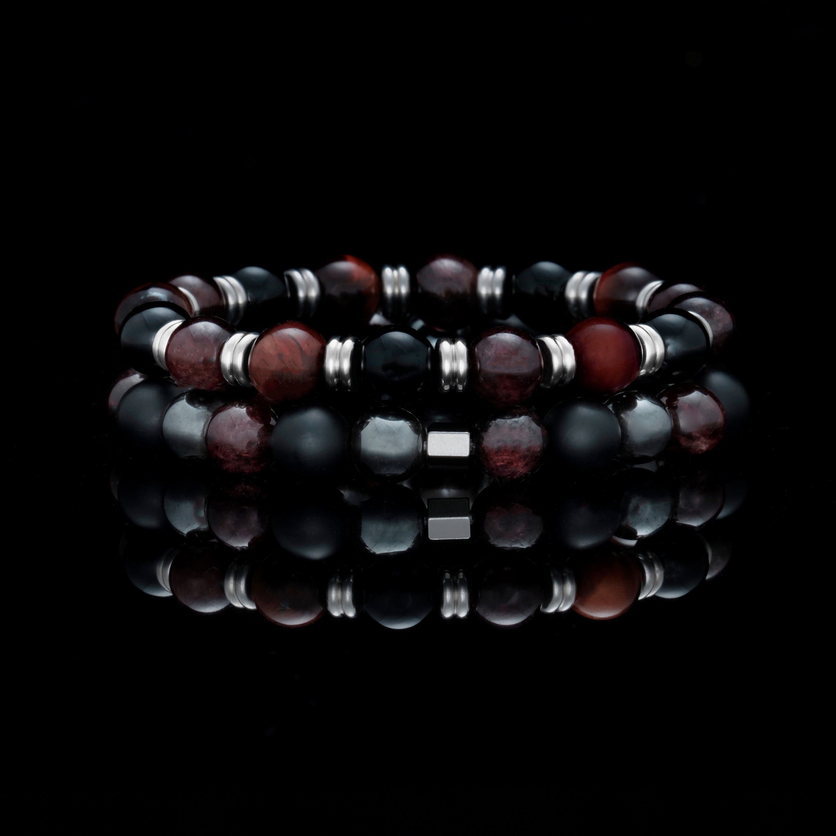The Cranberry Sauce introduces stack bracelets with our signature stainless spacer beads, finished with the red tiger eye stone. Our popular obsidian stone and the tiger eye bracelet is combined with stainless steel accessories to help you stay focused and determined while overcoming obstacles.