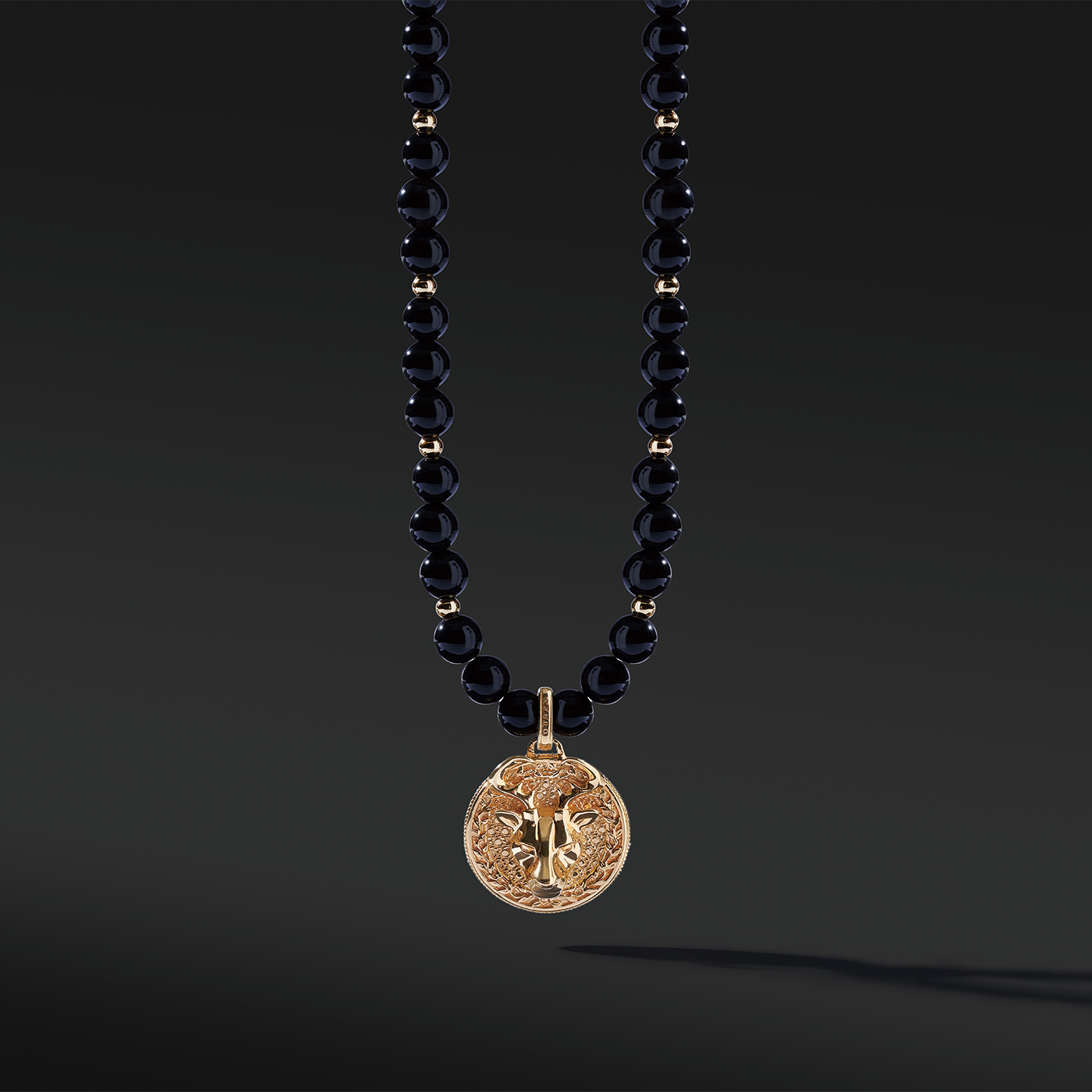 Obsidian pendant necklace in gold pendant takes the iconic black and gold color to life. Men's gold pendants attached to grade AAA Obsidian necklaces are a must-have. An Obsidian pendant necklace enlightens courage and amplifies strength. Gold pendants for men are classic jewelry a man should have.