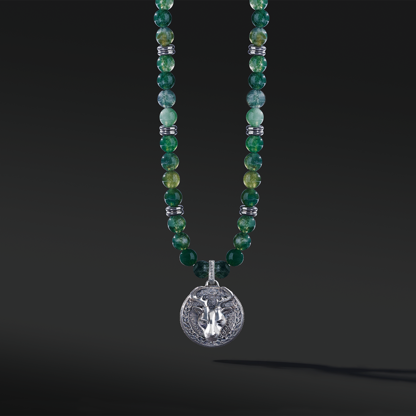 Know as the Green Moss Agate. One of the rarest agate crystals. Put 3 different tonalities of green Agate showcasing the richness of its presentation. Silver pendant necklace for men in green Agate has a gentle, sophisticated touch, and green Agate necklace releases stress and anxiety.