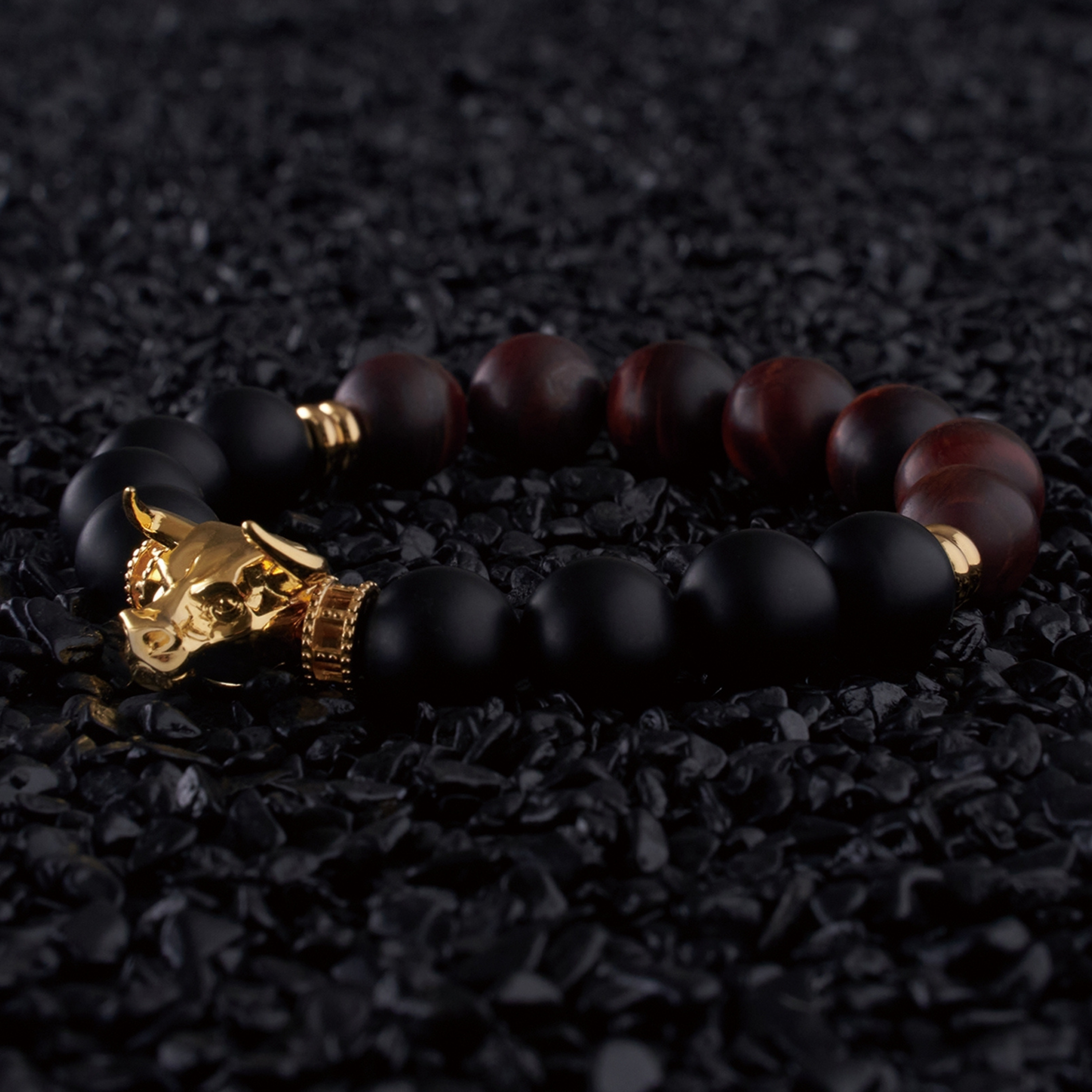 Gold bull jewelry with black obsidian bracelets symbolizes wealth and prosperity. Gold bull design in Chinese culture is believed to bring in good fortune. Azuro Republic grade AAA beaded bracelet for men with gold plated beads is hand polished. If you are looking for a custom men's beaded bracelet, you can learn more from our gemstone crystal beaded bracelet collection.