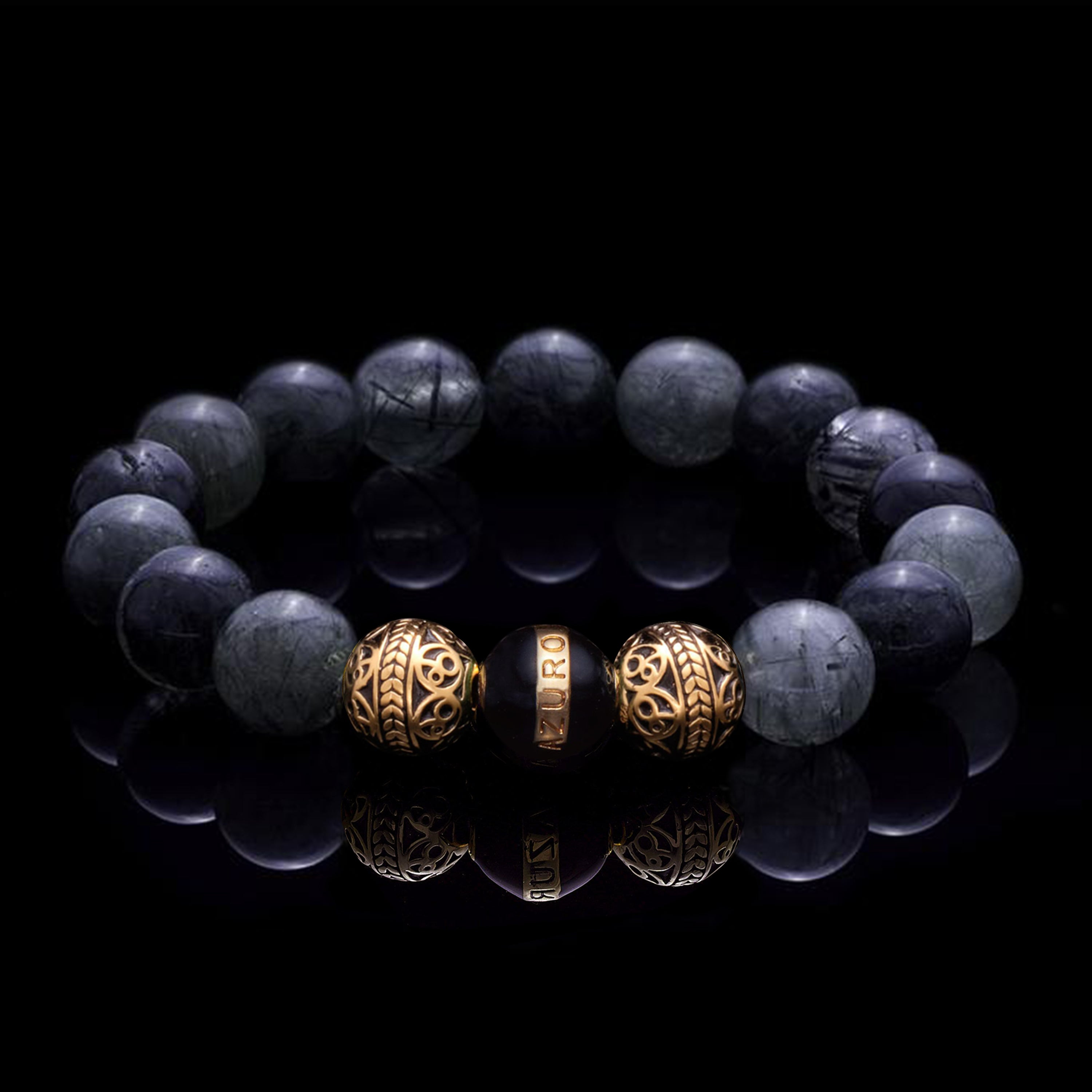 The Gold Enamel Black Gaia bracelet is consisted of Black Rutilated Quartz and 3 Microns 24k Gold Plated Beads, which can assist you to have a calm and collected mind, making you to see things clearer and solve the trials and tribulations in life with ease. With the Greek goddess Gaia symbolizing existence and balance, this bracelet for men helps bring harmony to life.