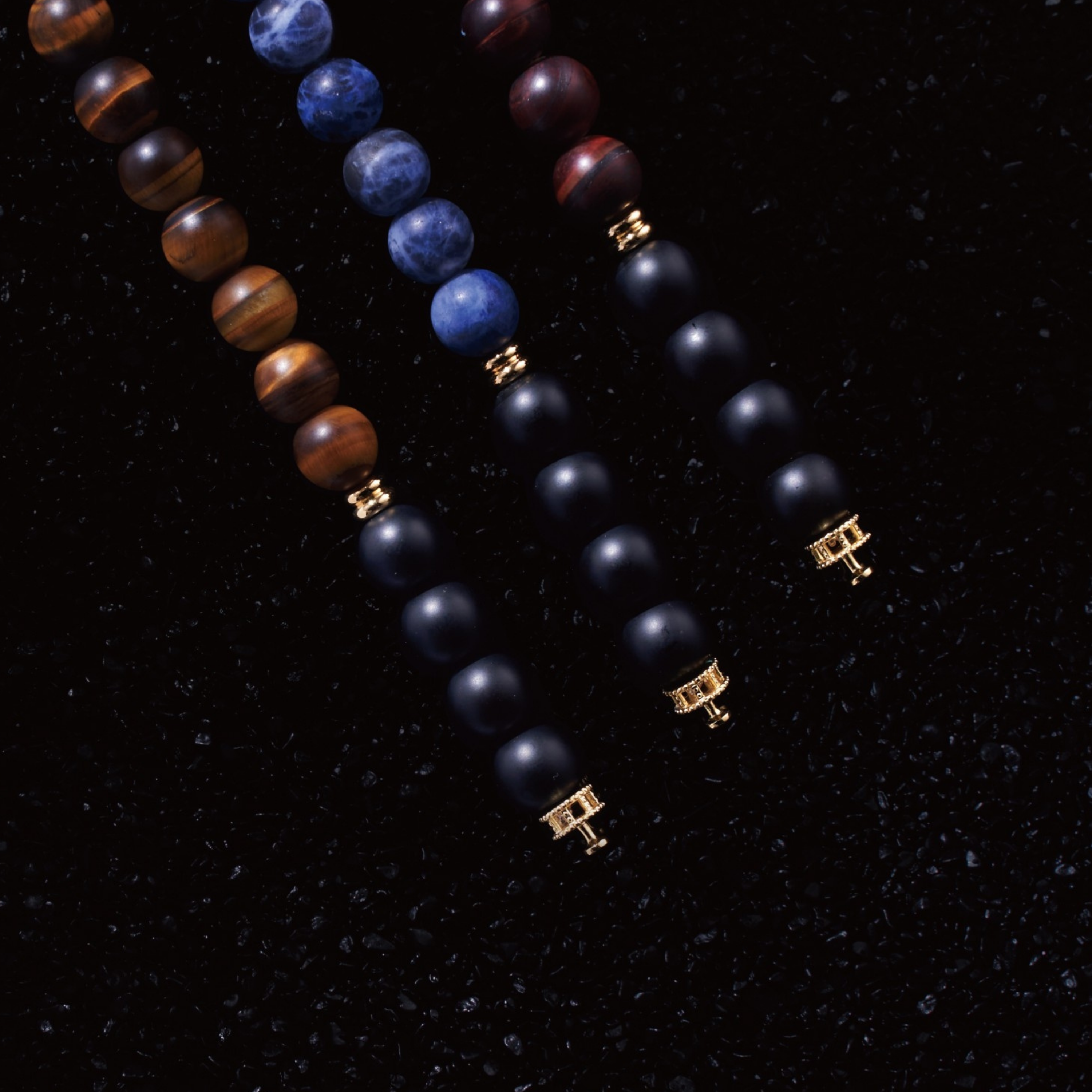 Matt Red Tiger Eye, Obsidian beaded bracelet is in the Tiger Eye crystal family, but with a burgundy color. Matured of its kind. Red Tiger Eye crystal brings confidence, good energy, and sparkles passion. Selected three men's beaded bracelets, obsidian, turquoise, and tiger eye match perfectly with Azuro Republic gold charm beads. The beaded bracelets cover the main color choices for men, black, blue, brown, and portrait a subtle gentleman look.