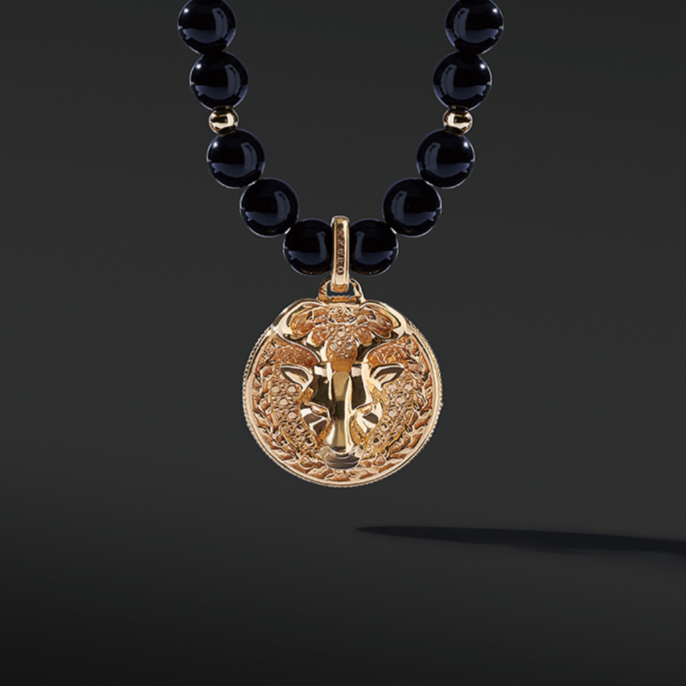Obsidian pendant necklace in gold pendant takes the iconic black and gold color to life. Men's gold pendants attached to grade AAA Obsidian necklaces are a must-have. An Obsidian pendant necklace enlightens courage and amplifies strength. Gold pendants for men are classic jewelry a man should have.