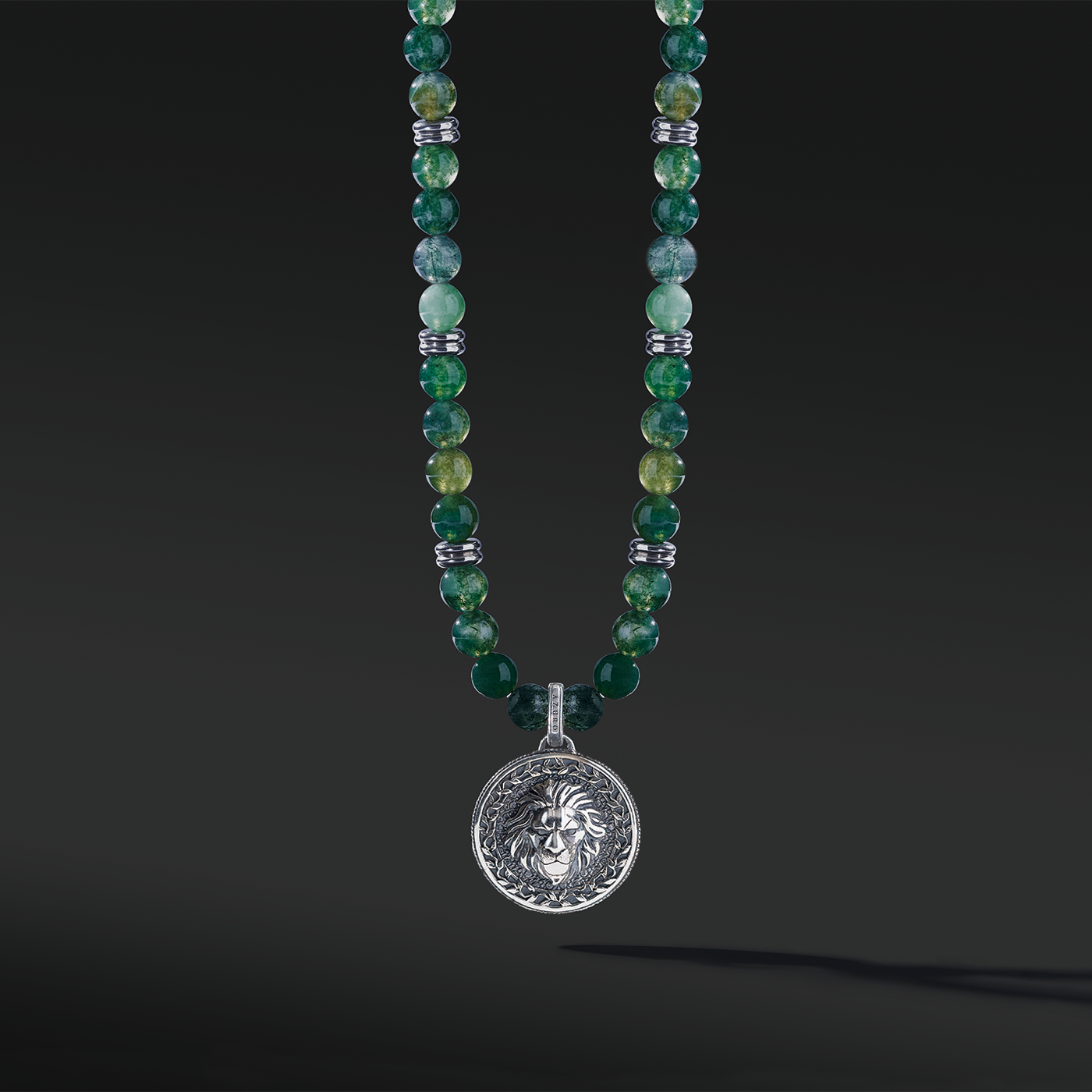 Know as the Green Moss Agate. One of the rarest agate crystals. Put 3 different tonalities of green Agate showcasing the richness of its presentation. Silver pendant necklace for men in green Agate has a gentle, sophisticated touch, and green Agate necklace releases stress and anxiety.