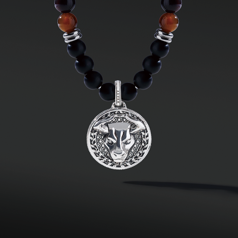 Red Tiger Eye beaded pendant necklace brings wealth and luck. A set of Obsidian crystals highlights the detail of the silver pendant. Mix red Tiger eye beads and Obsidian beads and bring in healing properties of protection and prosperity. Silver pendants for men in oxidization showcase masculinity.