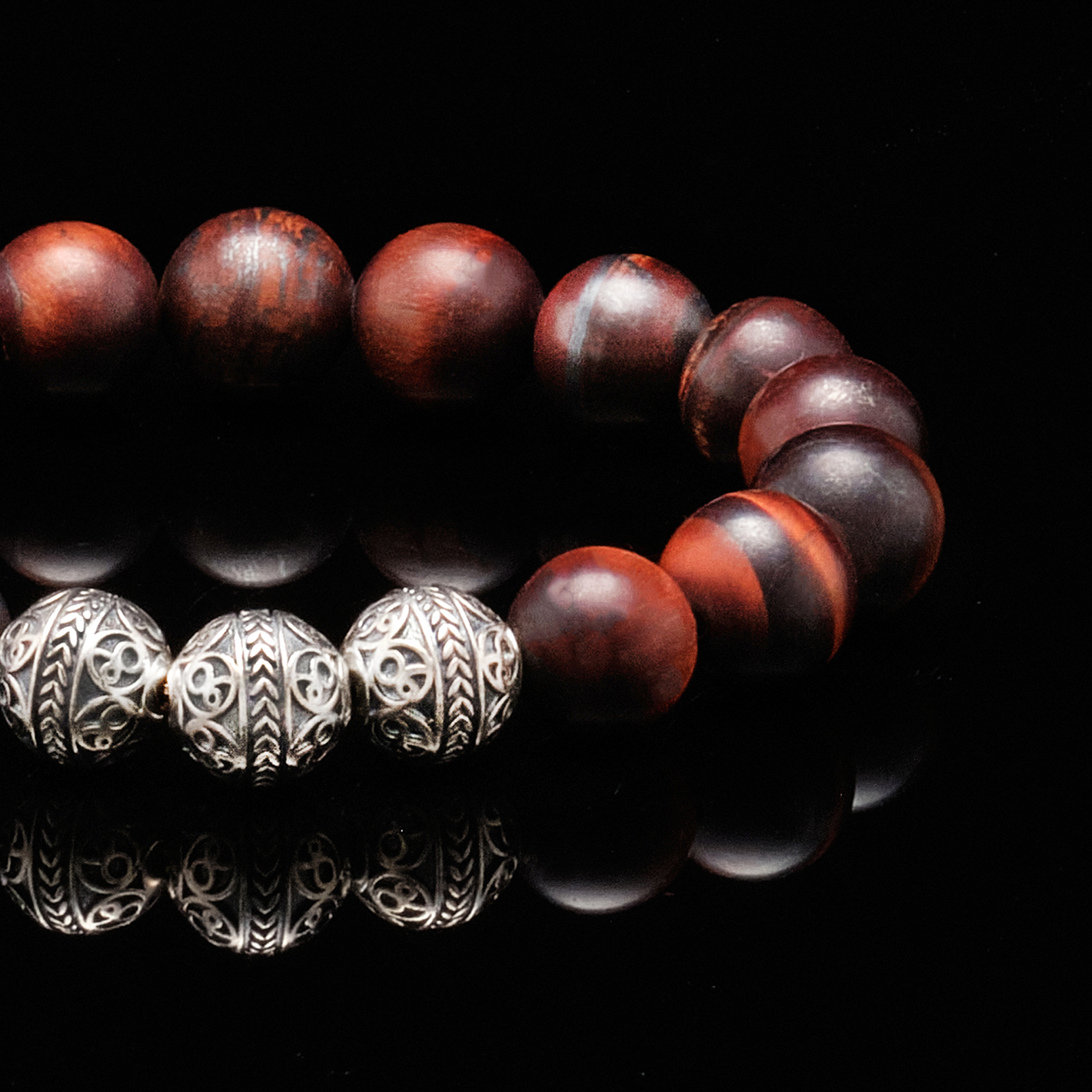 Made with Silver and Red tiger eye stone, the Matt Silver Red Tiger Eye bracelet has strong healing properties that keep your mind and body connected to the earth's energies. The red tiger eye stone is also known as the fighters gemstone, as when you wear this beaded bracelet with red tiger eye stone, you will feel the motivation to move forwards in life and it definitely helps you achieve whatever goal you have set for yourself.