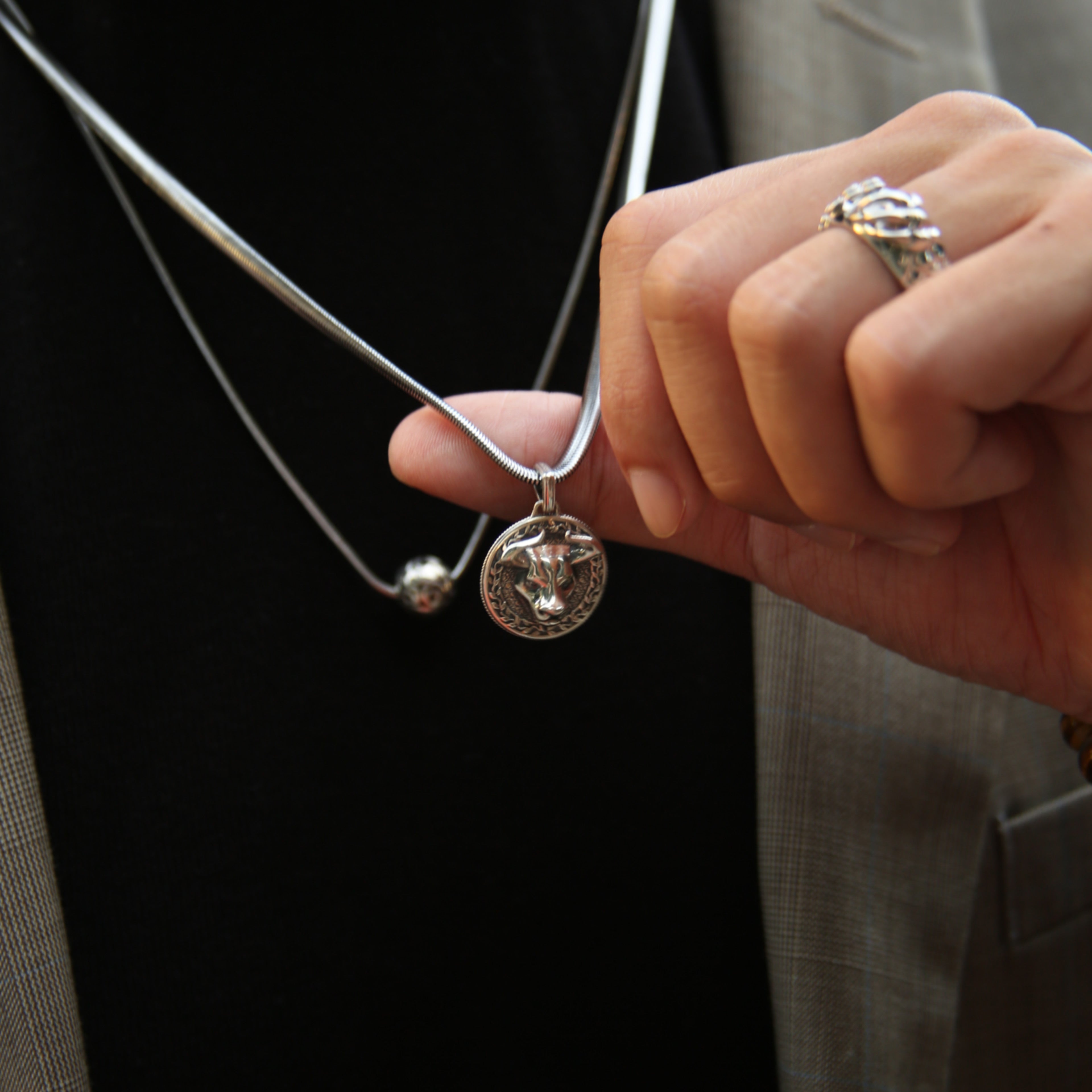 Bull silver pendant necklace in many cultures means prosperity, wealth, and it also means family and union. A bull silver pendant gives a solid appearance to a man. The fine polishing of the horns completes the sharpness of this creation. Azuro put together a collection of Bull pendants and bracelets.