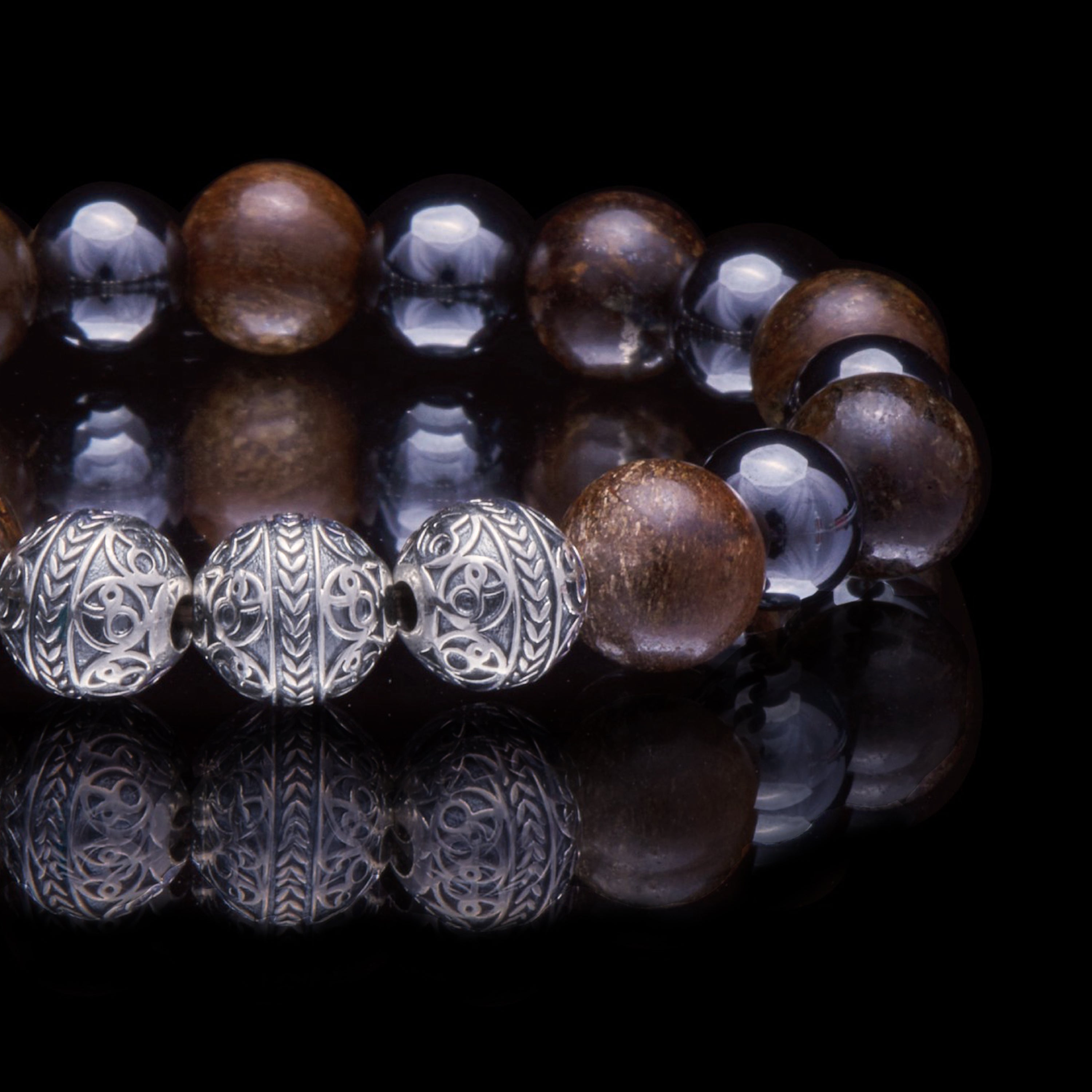 Apollo, the god of sun, is a symbol of courage and aspiration. What shines through this Apollo collection is its energy and positivity. This gemstone combination of Bronzite and Hematite is not only unique in its origin and creation but a belief to act within us and be true to whom we are.