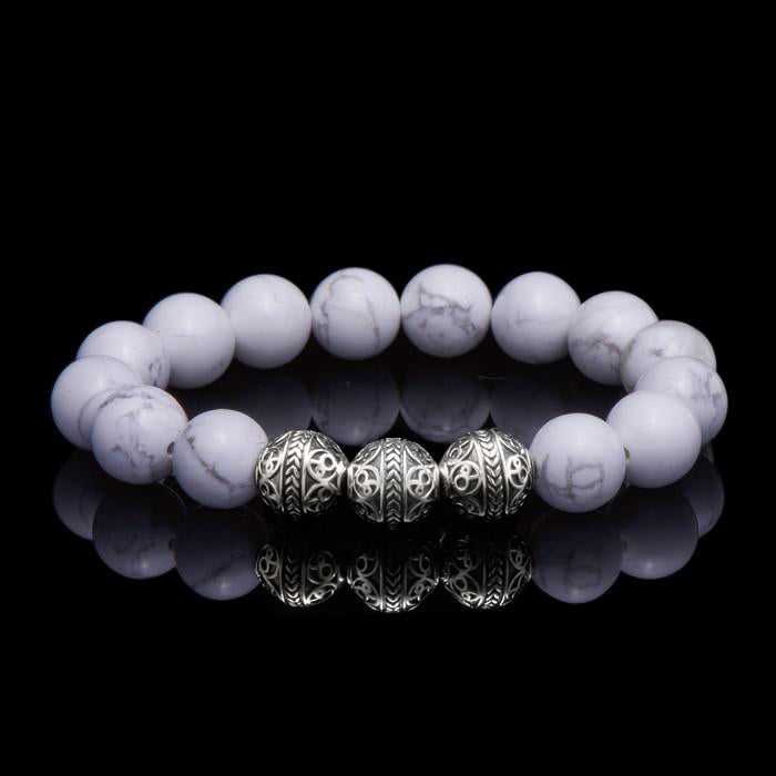 Howlite is a marble patterned borate mineral, and in its natural form presents a beautiful white crystal finished with delicate grey veins. The Howlite bracelet can bring clarity, facilitates awareness and stimulates desire for knowledge. The calming healing power of the Howlite stone will induce internal serenity and while compiling one’s outfit, simultaneously providing a classy gentleman look.