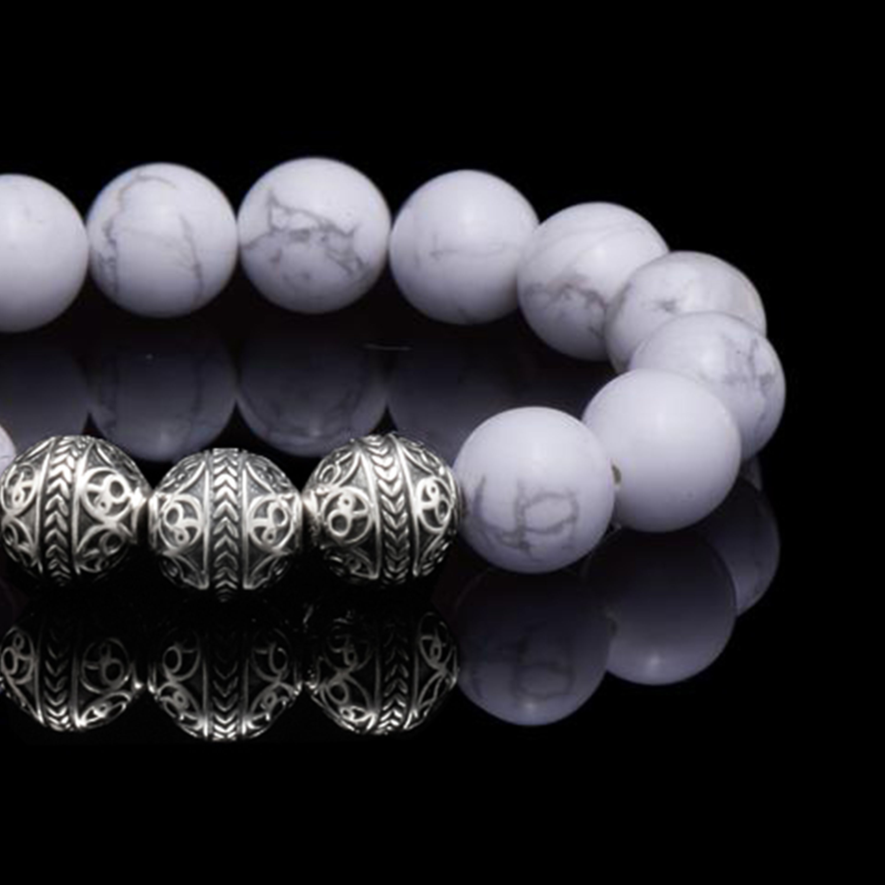 Howlite is a marble patterned borate mineral, and in its natural form presents a beautiful white crystal finished with delicate grey veins. The Howlite bracelet can bring clarity, facilitates awareness and stimulates desire for knowledge. The calming healing power of the Howlite stone will induce internal serenity and while compiling one’s outfit, simultaneously providing a classy gentleman look.