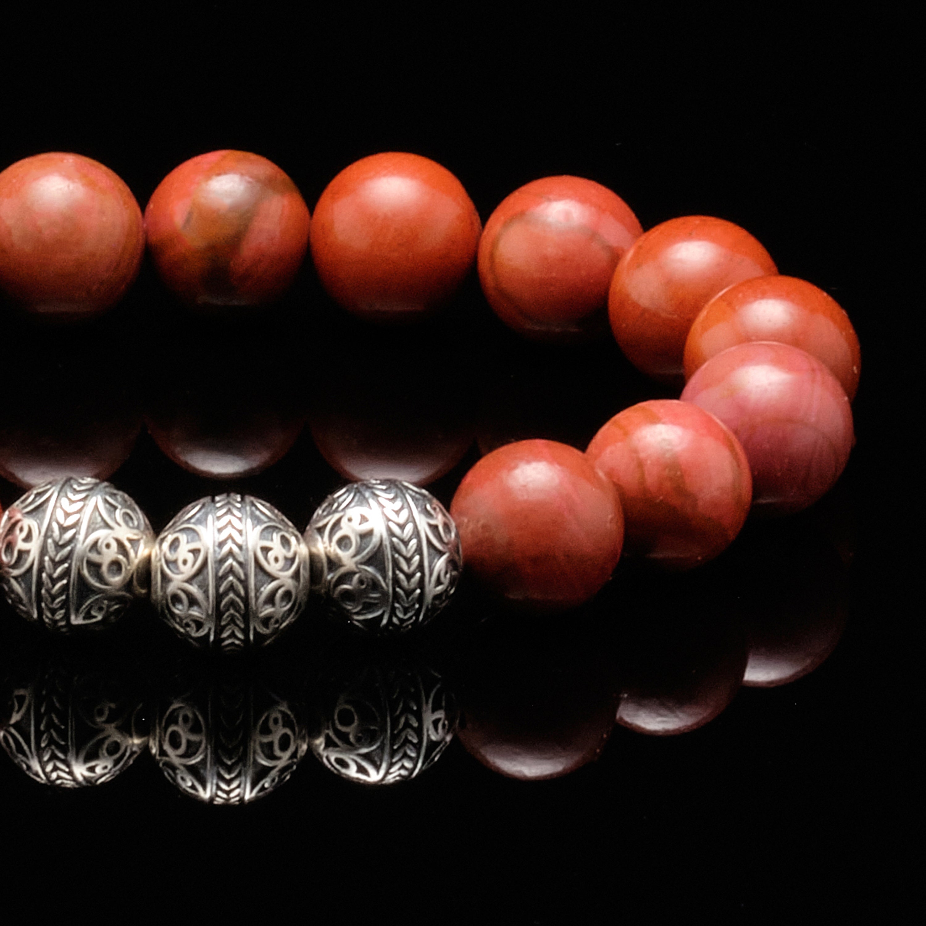 Red jasper bracelet owes its blush to iron impurities. As mens bead bracelet, red jasper bracelet symbolizes passion. The red jasper bracelet gives it a blood hue that provokes a passionate emotion. Passion is the key to leading excellence. Through infusing red Jasper bracelet gemstone properties into the base and sacral chakras.