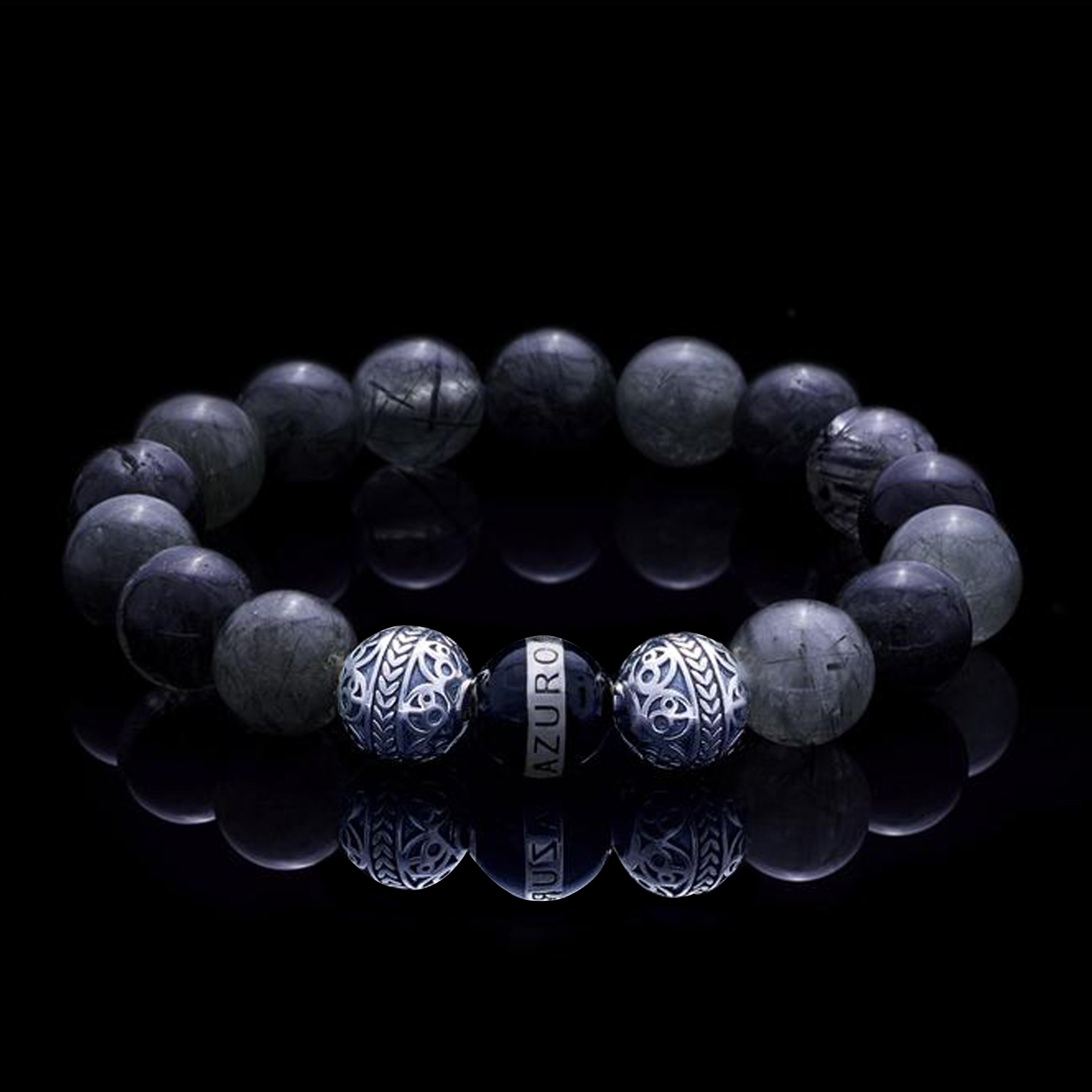 The Silver Enamel Black Gaia bracelet is consisted of Black Rutilated Quartz and 3 3 Premium 925 Sterling Silver beads, which can assist you to have a calm and collected mind, making you to see things clearer and solve the trials and tribulations in life with ease. With the Greek goddess Gaia symbolizing existence and balance, this silver bracelet for men helps bring harmony to life.