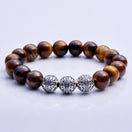 Tiger eye bracelet is a solar gemstone of vitality, action and success. It stimulates the root chakra, sacral chakra and solar plexus chakra to help you take action to achieve your dreams while remaining grounded, centered and calm.tiger eye jewelry, men's tiger eye bracelet, tiger eye bracelet, tiger eye bracelet for men, tiger eye bracelet, tiger eye beads, tiger eye healing properties