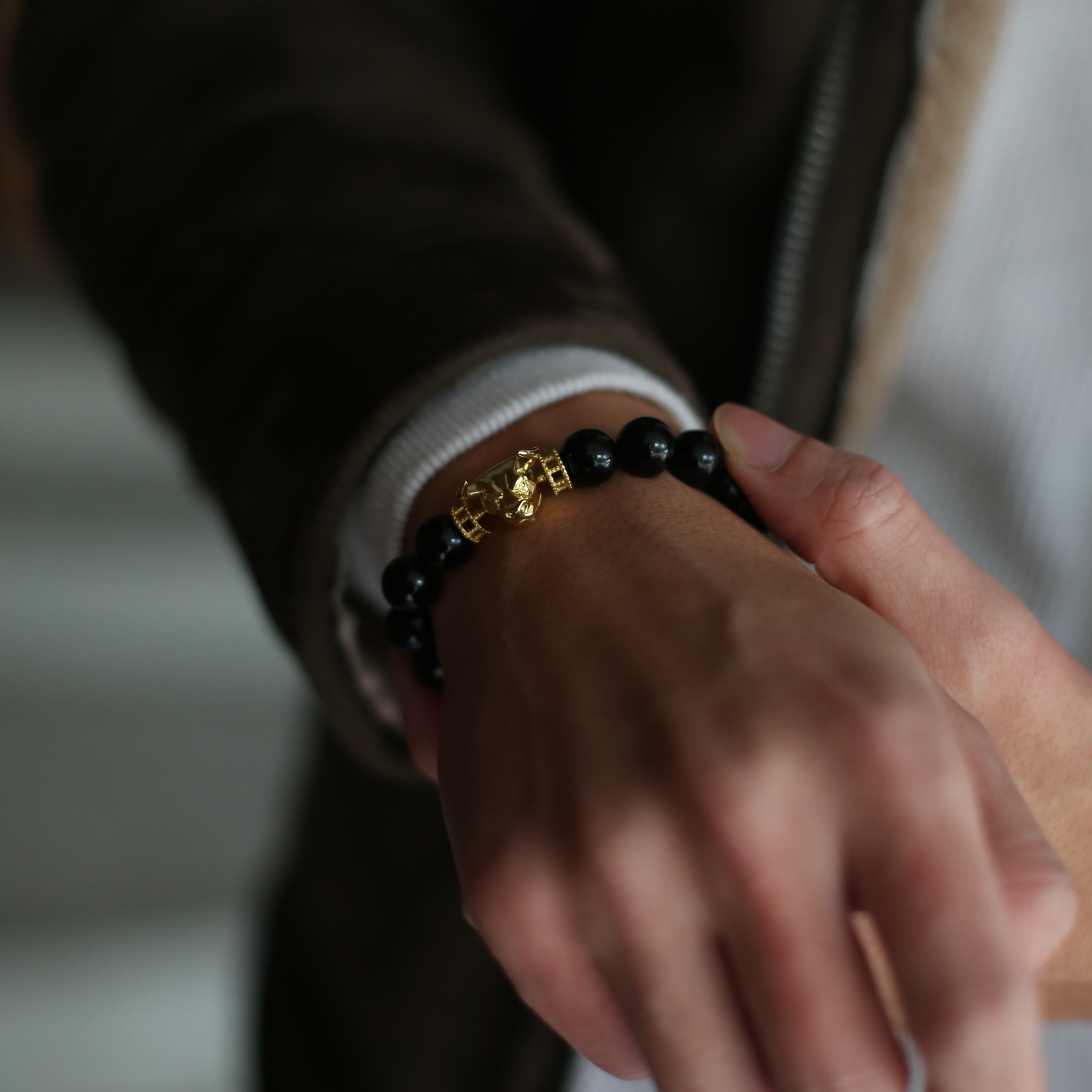 Selected three men's beaded bracelets, obsidian, turquoise, and tiger eye match perfectly with Azuro Republic gold charm beads. The beaded bracelets cover the main color choices for men, black, blue, brown, and portrait a subtle gentleman look. 