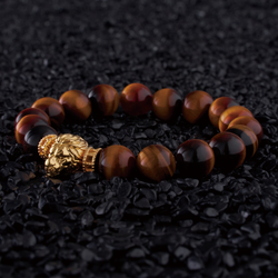 Gold lion bracelet is a clip bracelet mixing with Tiger Eye crystal. This men's beaded bracelet is a sophisticated handcrafted bracelet with a masculine gold lion charm. Tiger eye crystal attracts positivity.  If you are looking for a custom men's beaded bracelet, you can learn more from our gemstone crystal beaded bracelet collection. 
