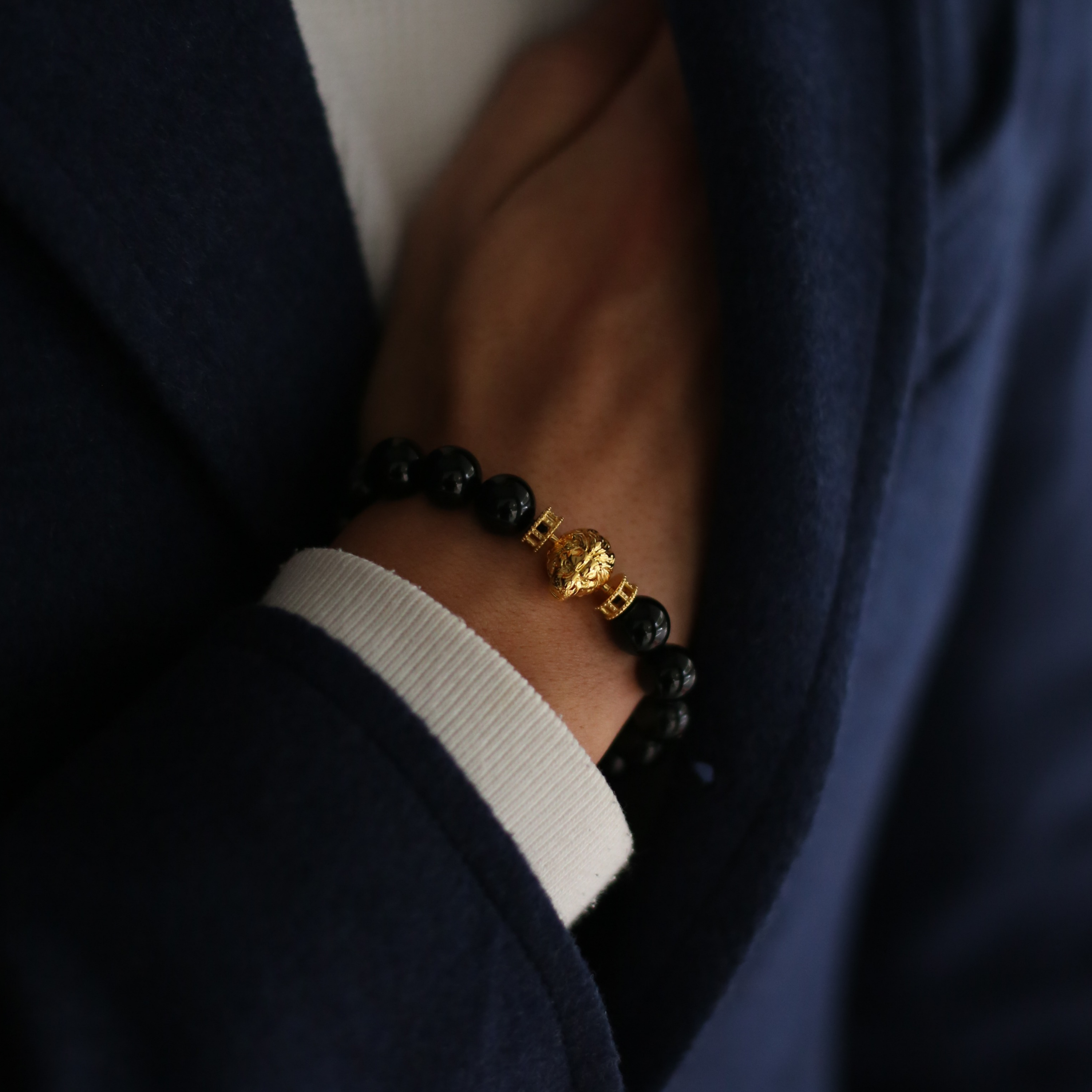 Selected three men's beaded bracelets, obsidian, turquoise, and tiger eye match perfectly with Azuro Republic gold charm beads. The beaded bracelets cover the main color choices for men, black, blue, brown, and portrait a subtle gentleman look. 