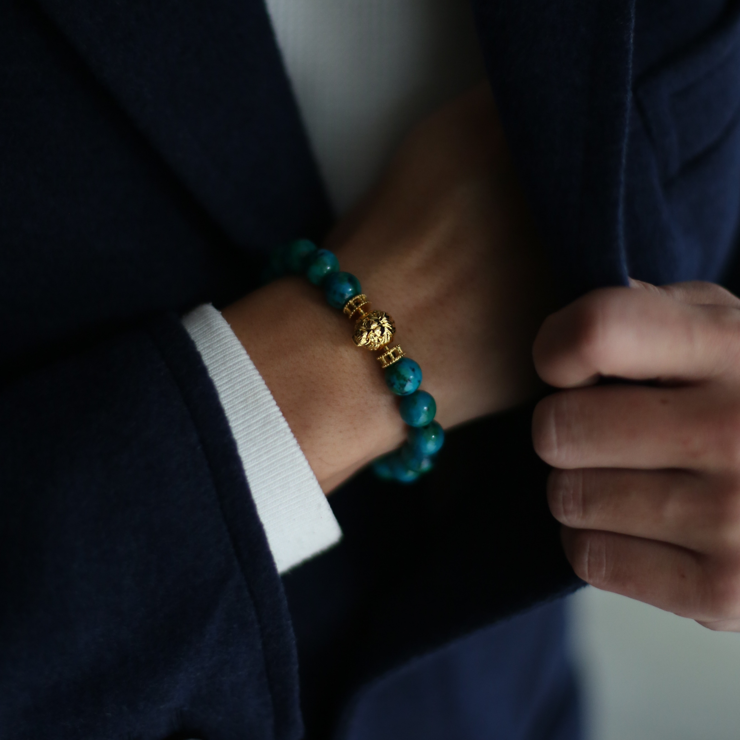 Selected three men's beaded bracelets, obsidian, turquoise, and tiger eye match perfectly with Azuro Republic gold charm beads. The beaded bracelets cover the main color choices for men, black, blue, brown, and portrait a subtle gentleman look. 