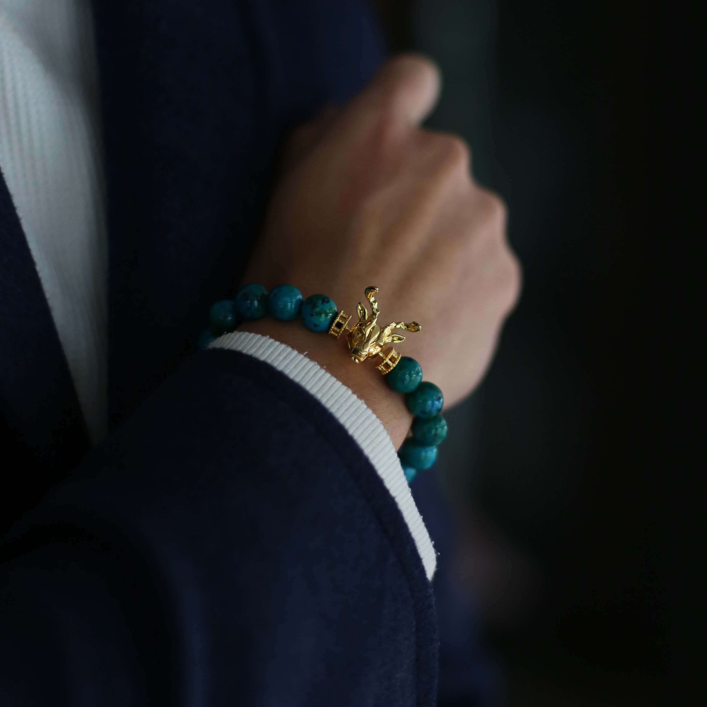 Selected three men's beaded bracelets, obsidian, turquoise, and tiger eye match perfectly with Azuro Republic gold charm beads. The beaded bracelets cover the main color choices for men, black, blue, brown, and portrait a subtle gentleman look. 