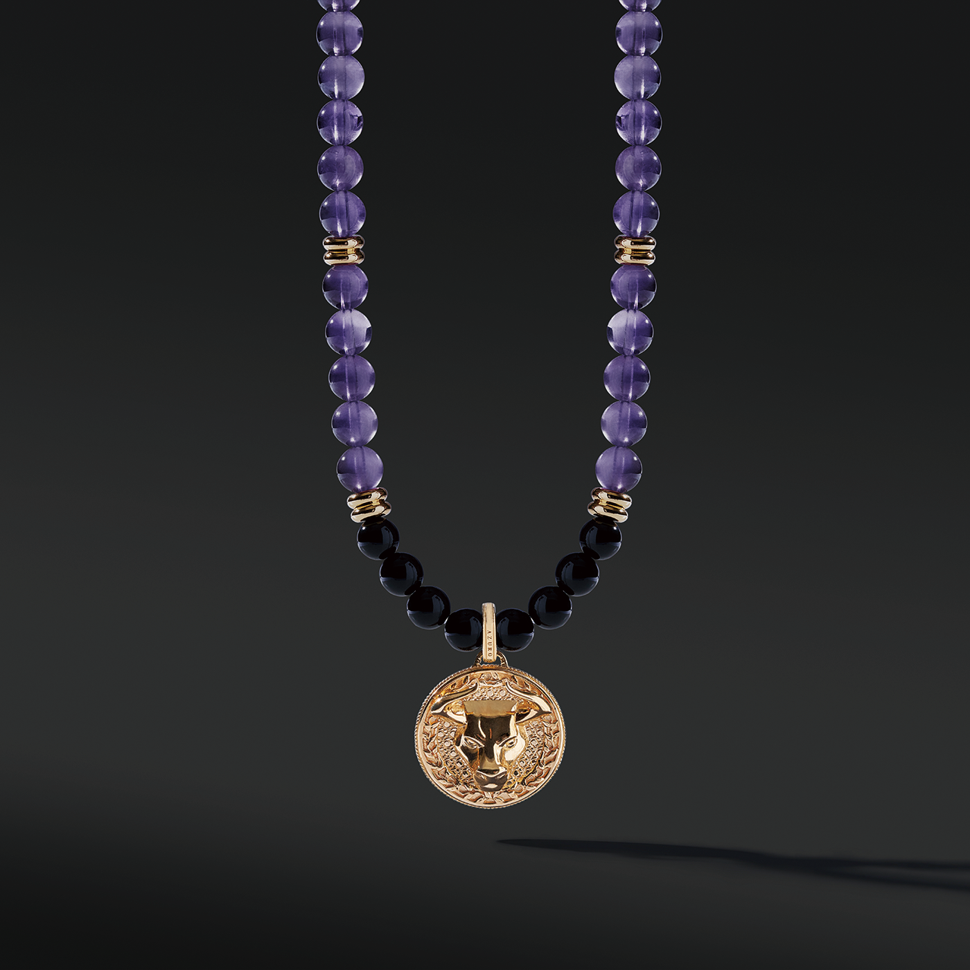 Gold Amethyst Beaded Necklace has a purple clarity and brings calmness. The attached gold connector and gold pendants give a luxurious presentation. Mens' gold pendant with a beaded necklace is a classic and unique style to carry.