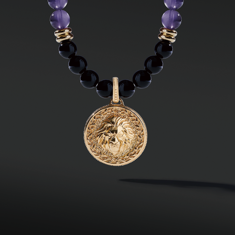 Gold Amethyst Beaded Necklace has a purple clarity and brings calmness. The attached gold connector and gold pendants give a luxurious presentation. Mens' gold pendant with a beaded necklace is a classic and unique style to carry.