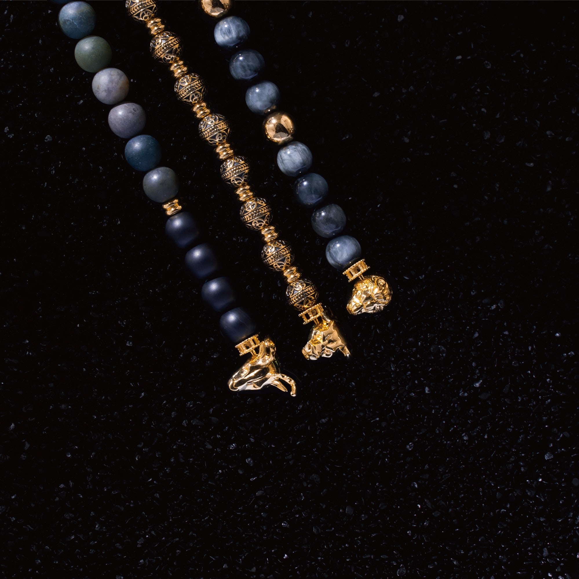 Selected three men's beaded bracelets, obsidian, turquoise, and tiger eye match perfectly with Azuro Republic gold charm beads. The beaded bracelets cover the main color choices for men, black, blue, brown, and portrait a subtle gentleman look. 