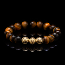 We bring you the Gold Classic Tiger Eye bracelet, a men's beaded bracelet, made for those men in leadership positions, as the tiger eye stone helps you stay centered and calm despite the ups and downs. This Tiger Eye beaded bracelet with a touch of gold is the men's beaded bracelet to have with you when there is an important decision to be made, as the tiger eye stone will balance your inner self and you will accept whatever life throws at you.