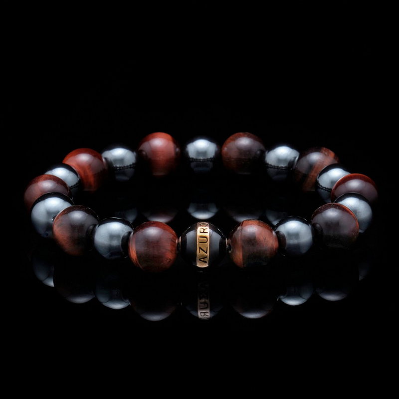 The Maximus, meaning "greatest" in Latin, is the symbolic red tiger eye bracelet for the ultimate fighter. The chakra healing bracelet promotes the properties of both red tiger eye and hematite, and act as a stimulating force of support for the feisty spirit of life. Red tiger eye bracelet infuses motivational energy, and with the gladiator-like Maximus, it will inject fuel for a boost of confidence for the man who strives to be the Greatest of All Time. 