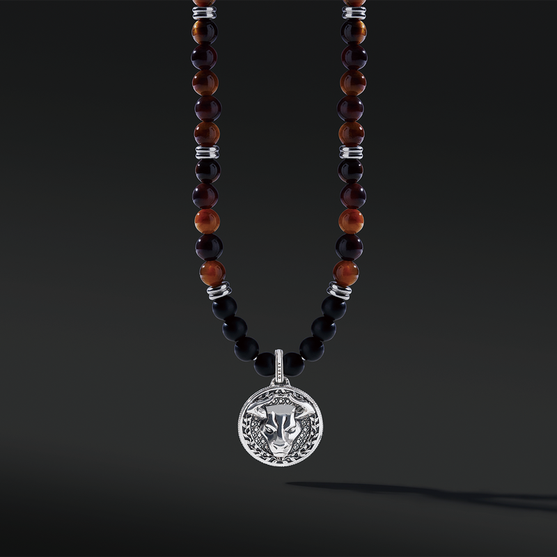 Red Tiger Eye beaded pendant necklace brings wealth and luck. A set of Obsidian crystals highlights the detail of the silver pendant. Mix red Tiger eye beads and Obsidian beads and bring in healing properties of protection and prosperity. Silver pendants for men in oxidization showcase masculinity.