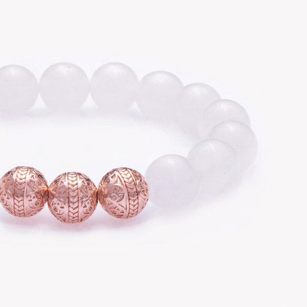 The White jade bracelet in combination with classic rose gold beads, promotes tranquility and radiates a peaceful glow. White Jade is made up of stunning nephrite jade stones with a translucent gleam. Representing unselfishness and hope, the White Jade bracelet inspires those in leadership roles to wear a white jade bracelet as they are the most trustworthy among a group, and can use the properties of bringing harmony and improving the cooperation in the workplace. 