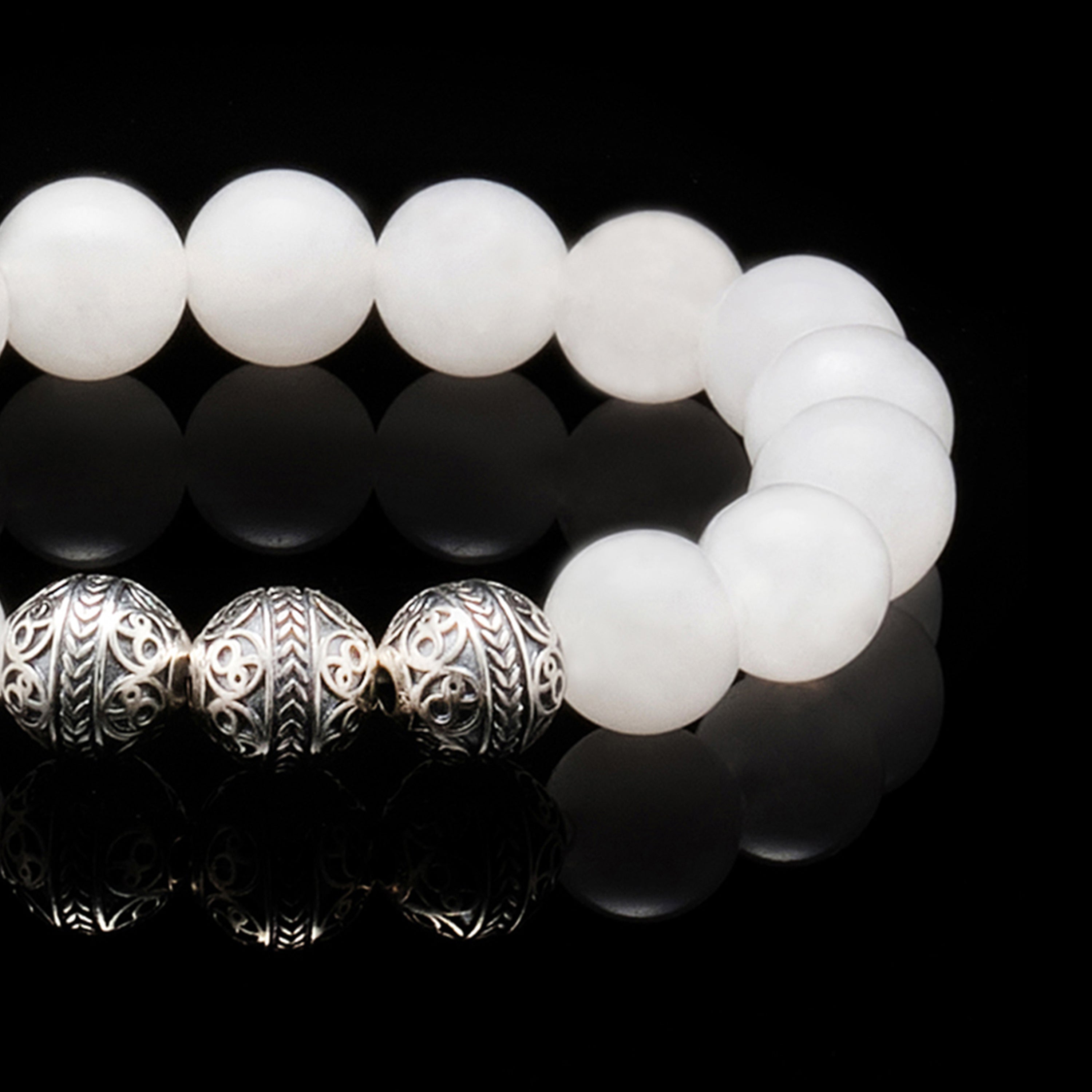 The Silver Classic White Jade Bracelet is a must-have elegant men's beaded bracelet, made with stunning translucid white jade stone with a classy touch of 925 Silver. If you consider yourself an entrepreneur this is definitely the men's beaded bracelet for you, as the white jade stone has been valued since ancient times because of its abilities to bring luck business.