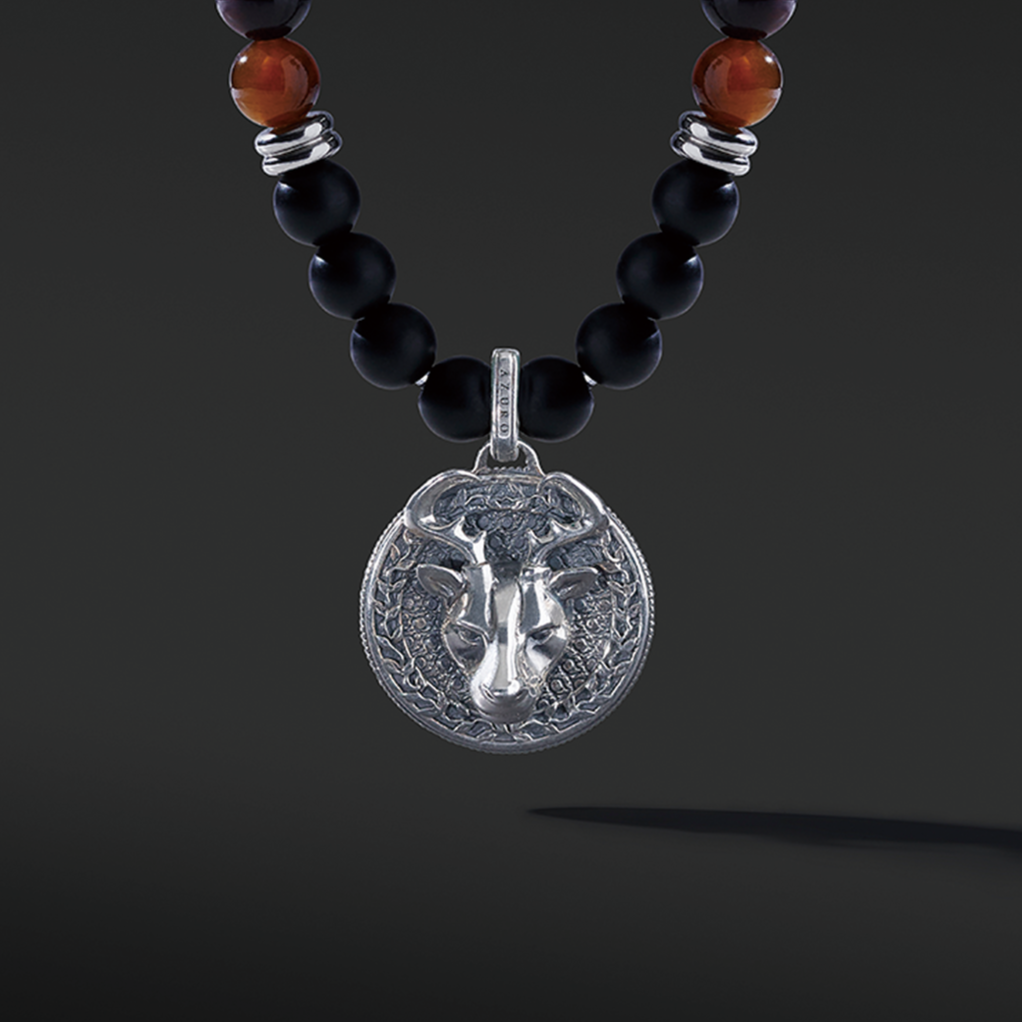 Red Tiger Eye beaded pendant necklace brings wealth and luck. A set of Obsidian crystals highlights the detail of the silver pendant. Mix red Tiger eye beads and Obsidian beads and bring in healing properties of protection and prosperity. Silver pendants for men in oxidization showcase masculinity.