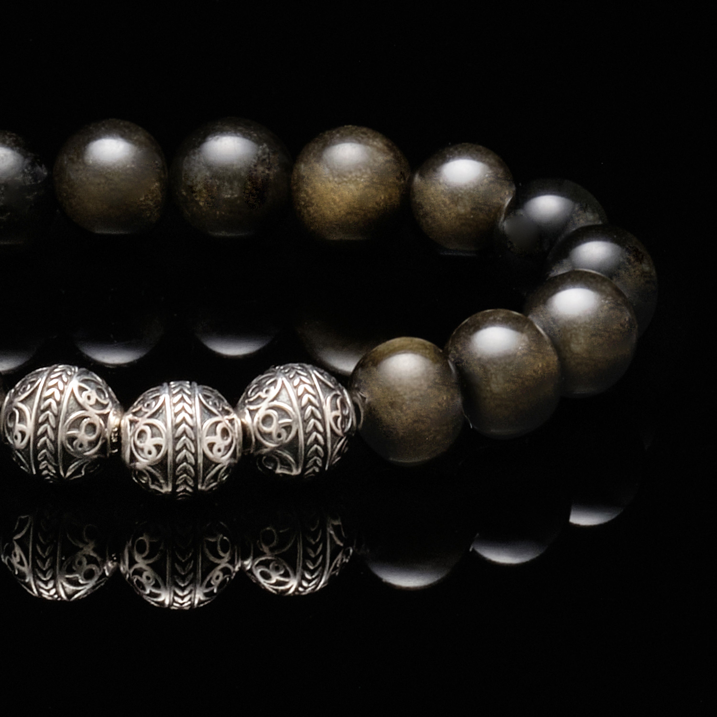Gold Black Obsidian stone combine with Premium 925 Sterling Silver beads make up the silver beaded bracelet for men that leads the gentlemen toward the path of braveness and truthfulness.