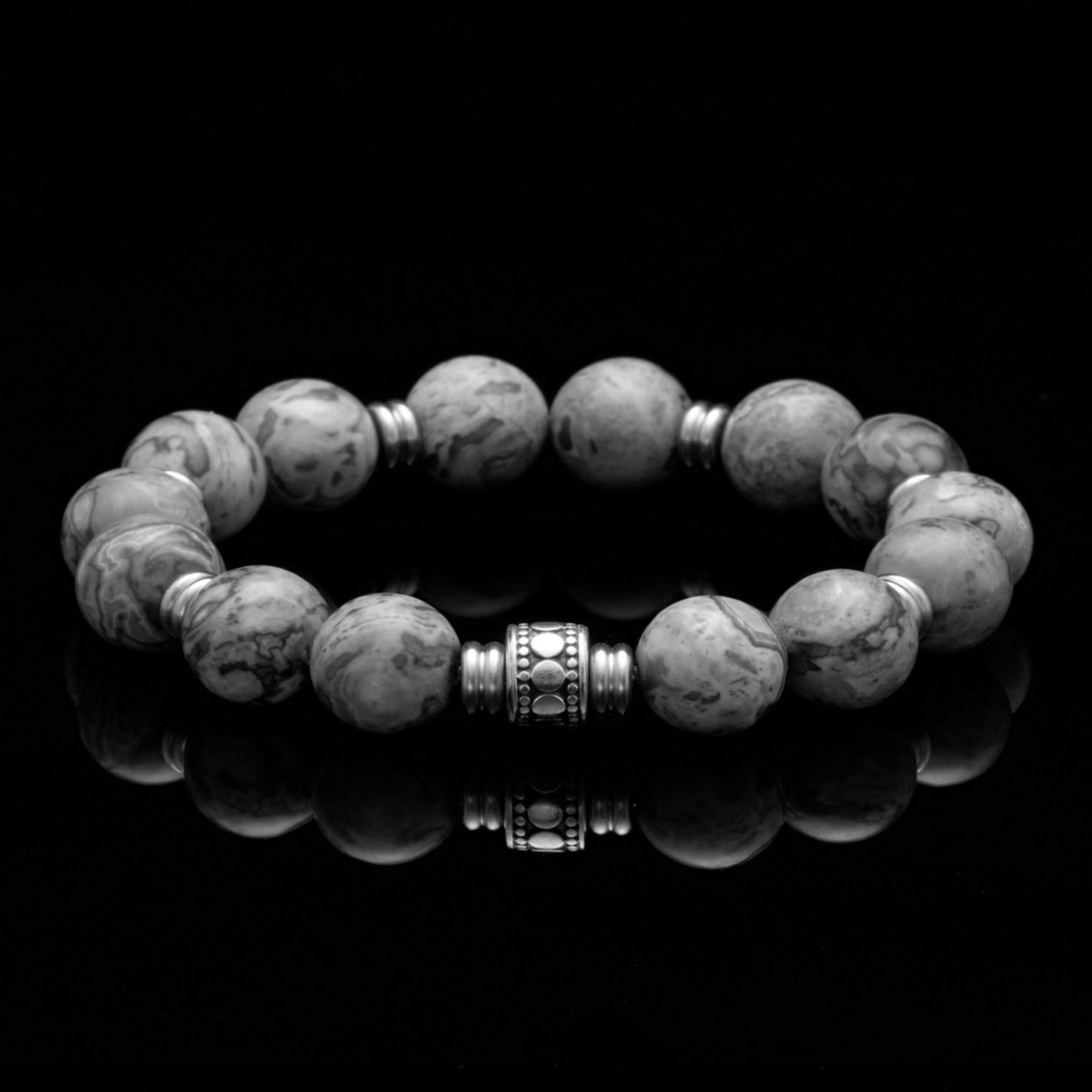 The Crown Chakra bracelet is one of the 7 Chakra bracelets. Combined with the Picasso Jasper stone, this mens silver bracelet symbolizes the finer things in life through the beautiful pattern on the chakra stones. Wearing a chakra bracelet has many benefits. The mens silver bracelets with Picasso Jasper stone is a transformer that heightens gratitude and will help attract the bond between like-minded individuals.