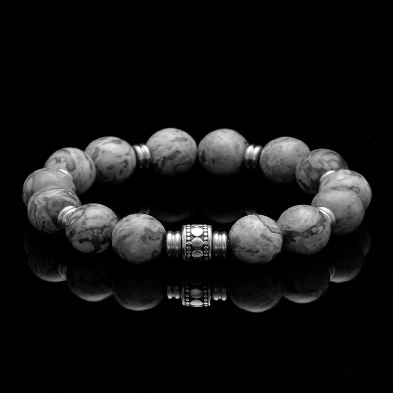The Crown Chakra bracelet is one of the 7 Chakra bracelets. Combined with the Picasso Jasper stone, this mens silver bracelet symbolizes the finer things in life through the beautiful pattern on the chakra stones. Wearing a chakra bracelet has many benefits. The mens silver bracelets with Picasso Jasper stone is a transformer that heightens gratitude and will help attract the bond between like-minded individuals.